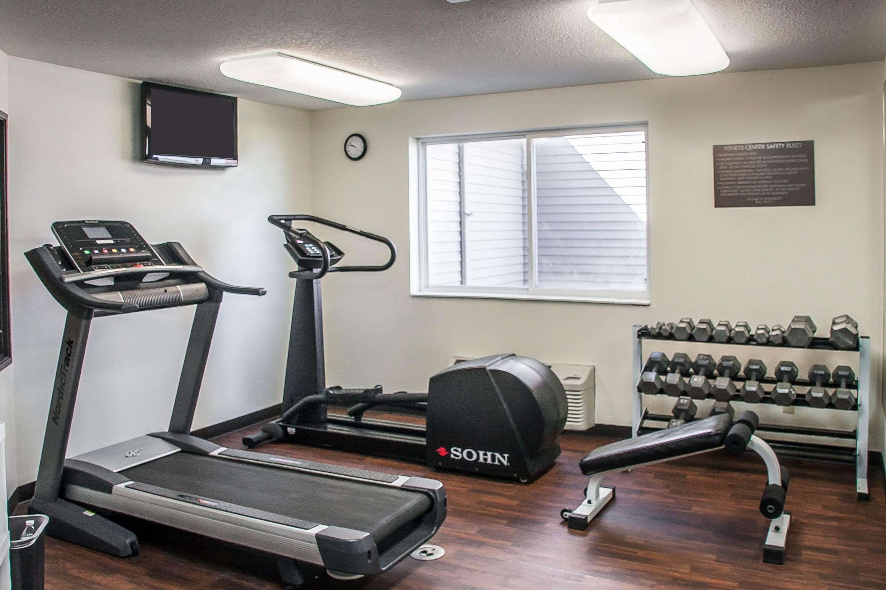 Exercise room with cardio equipment and weights | Comfort Inn Fergus Falls