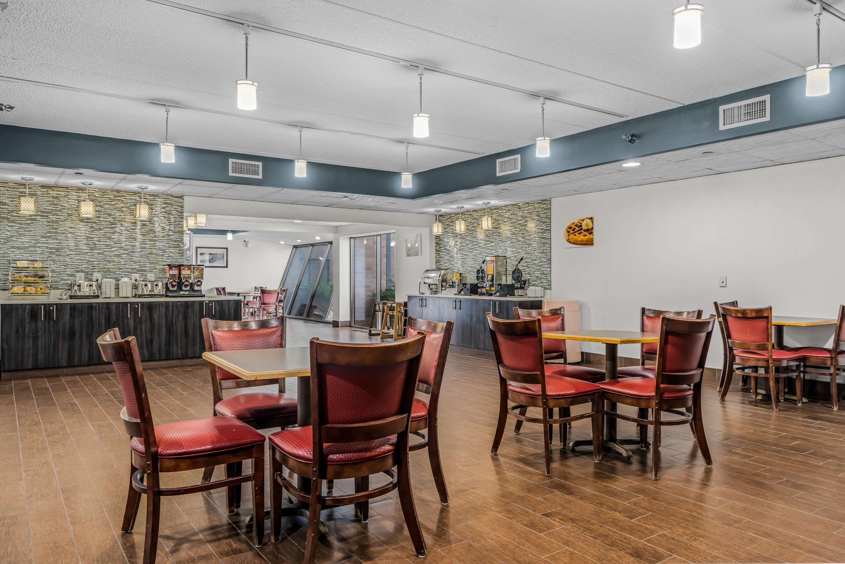 Enjoy breakfast in this seating area | Quality Inn & Suites Mall of America - MSP Airport