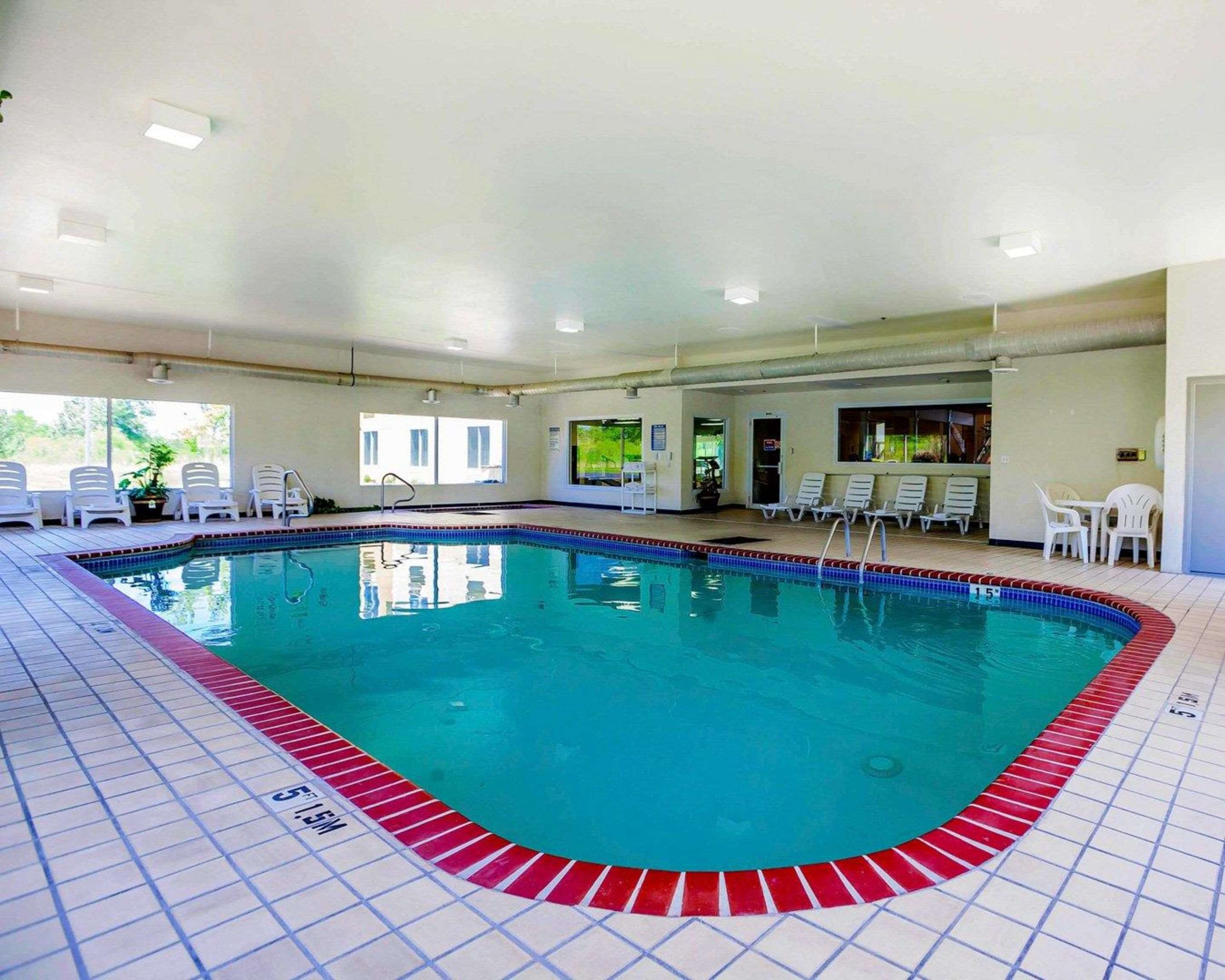 Indoor pool lounge area | Quality Inn