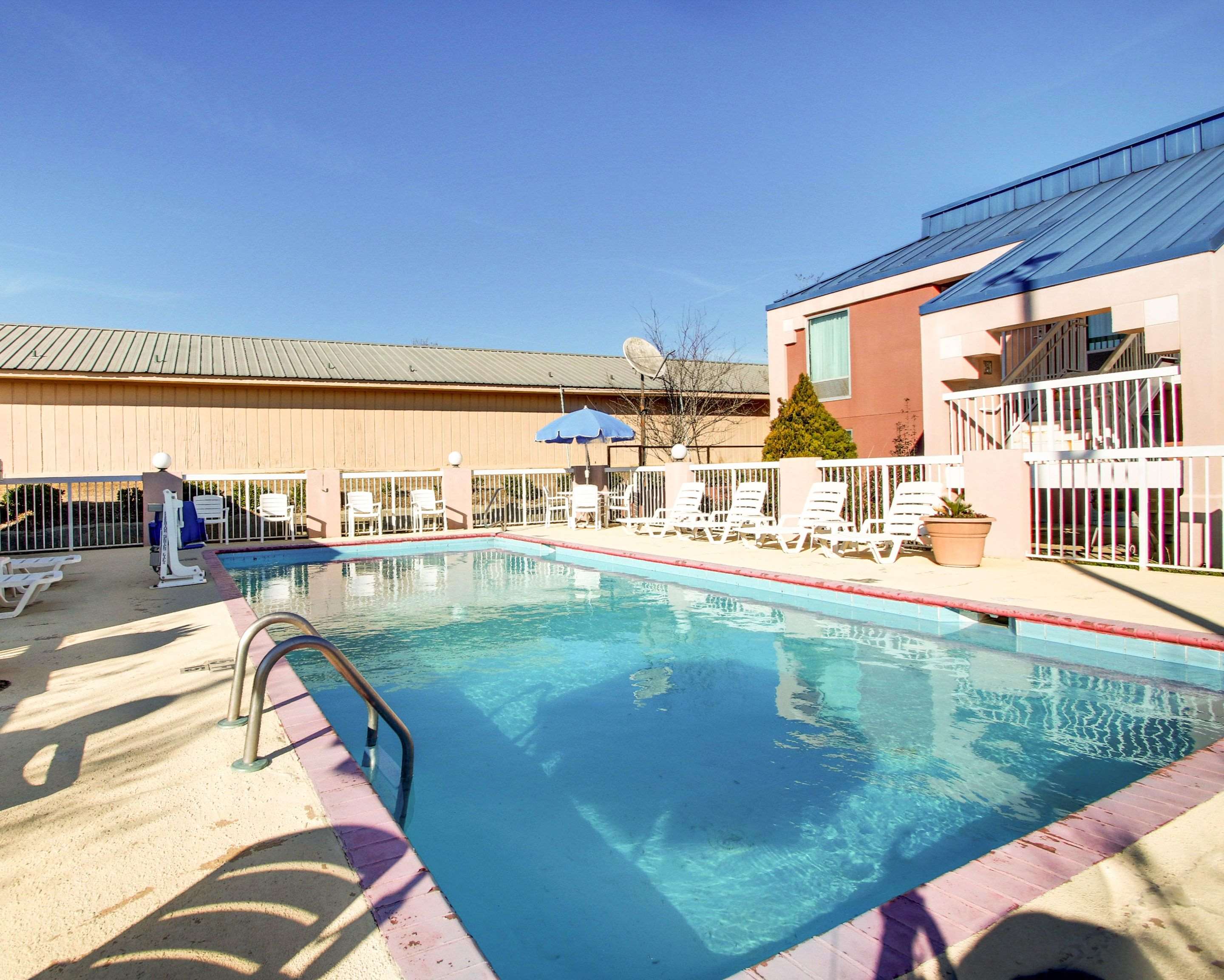 Outdoor pool with sundeck | Quality Inn Brookhaven