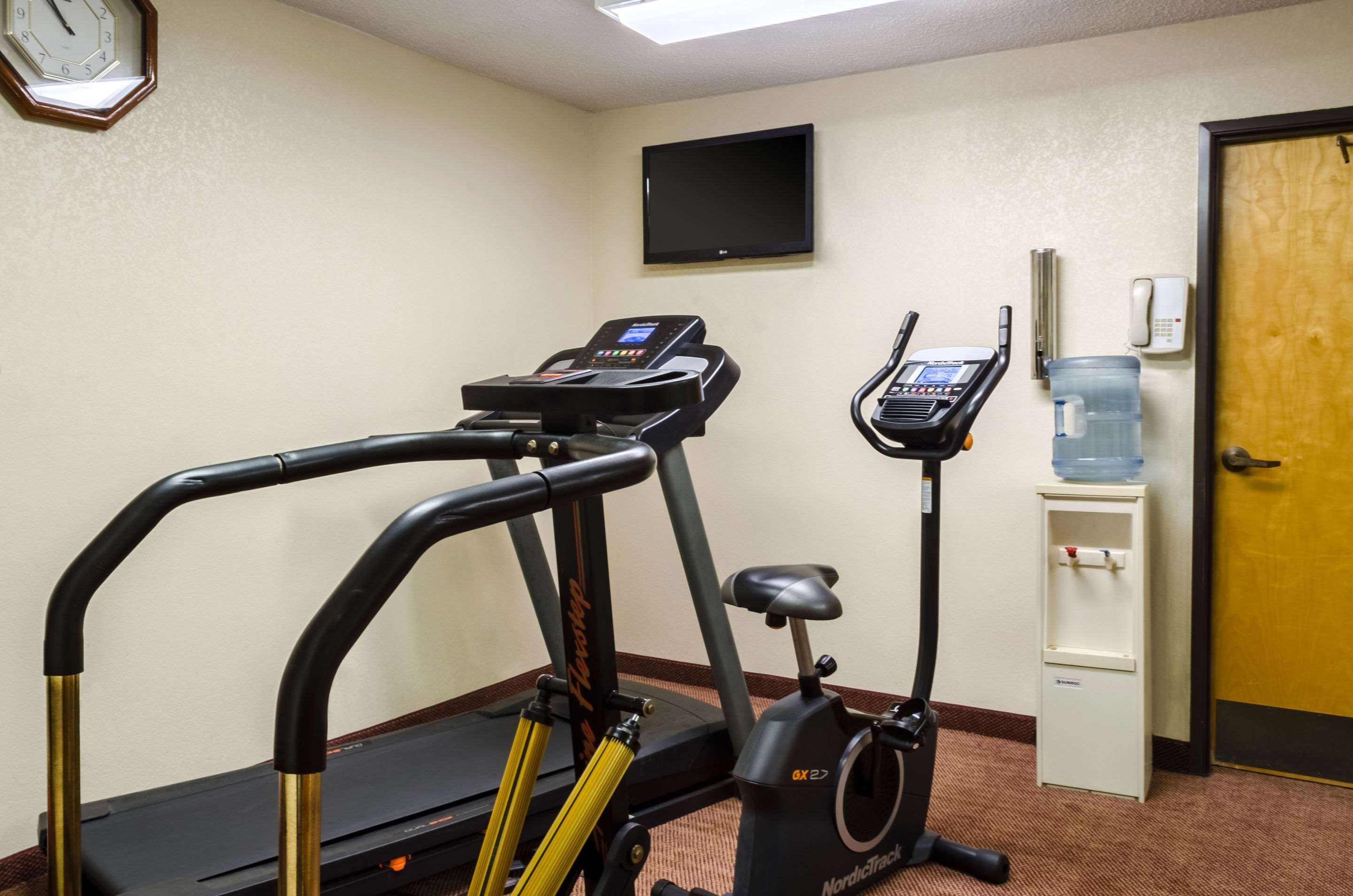 Exercise room with cardio equipment | Quality Inn