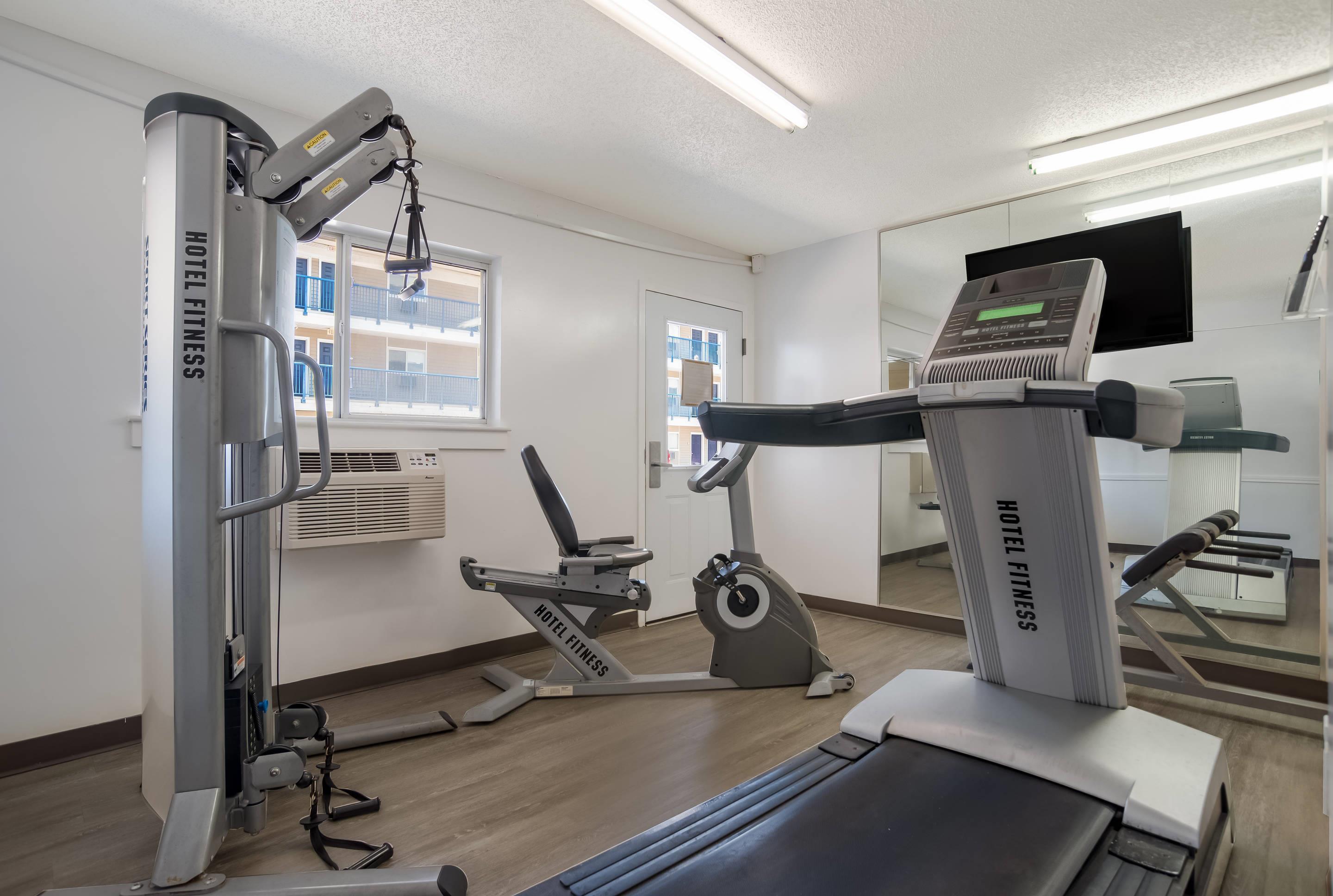 Exercise room with cardio equipment | Suburban Studios Biloxi North Area