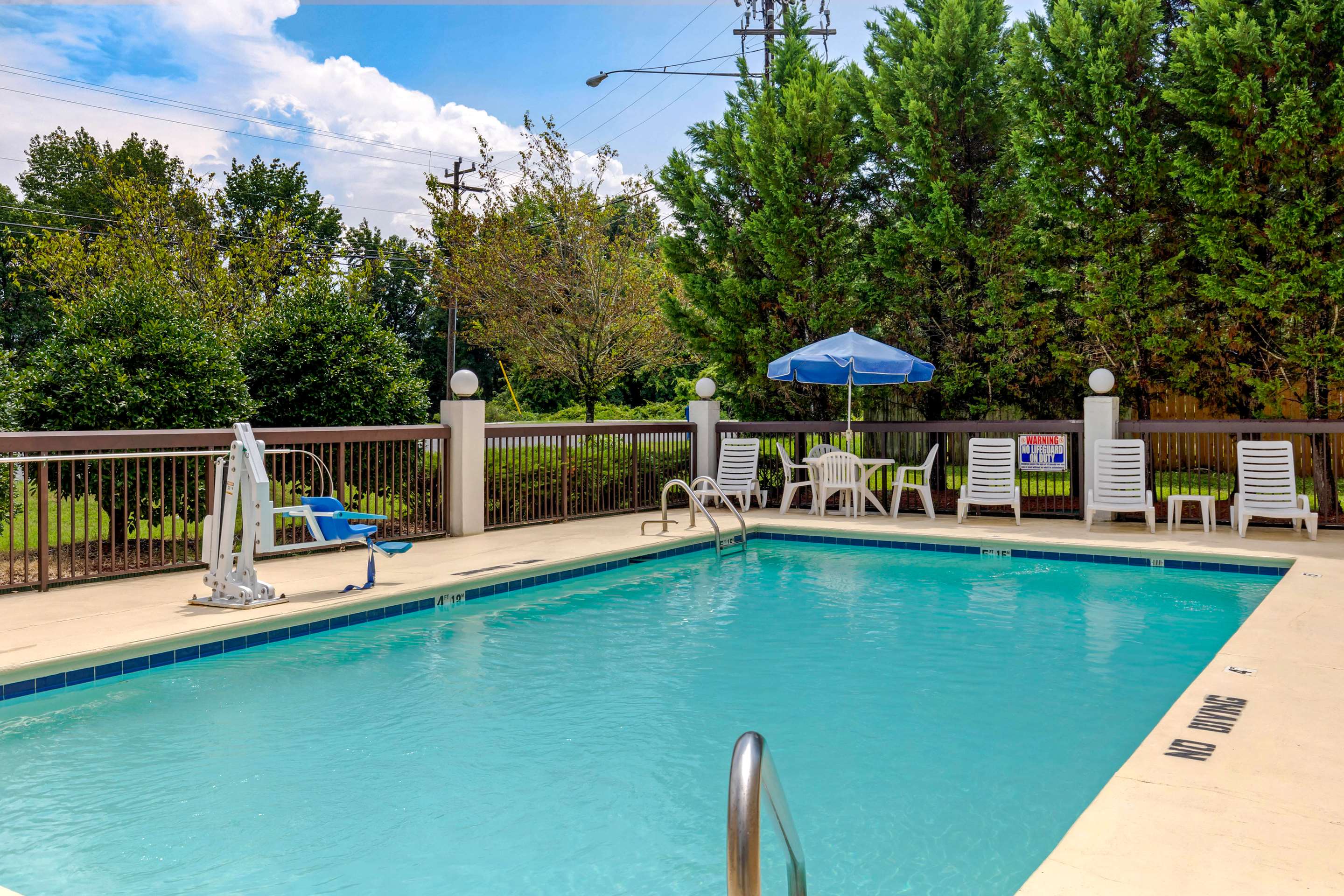 Outdoor pool | Quality Inn High Point - Archdale