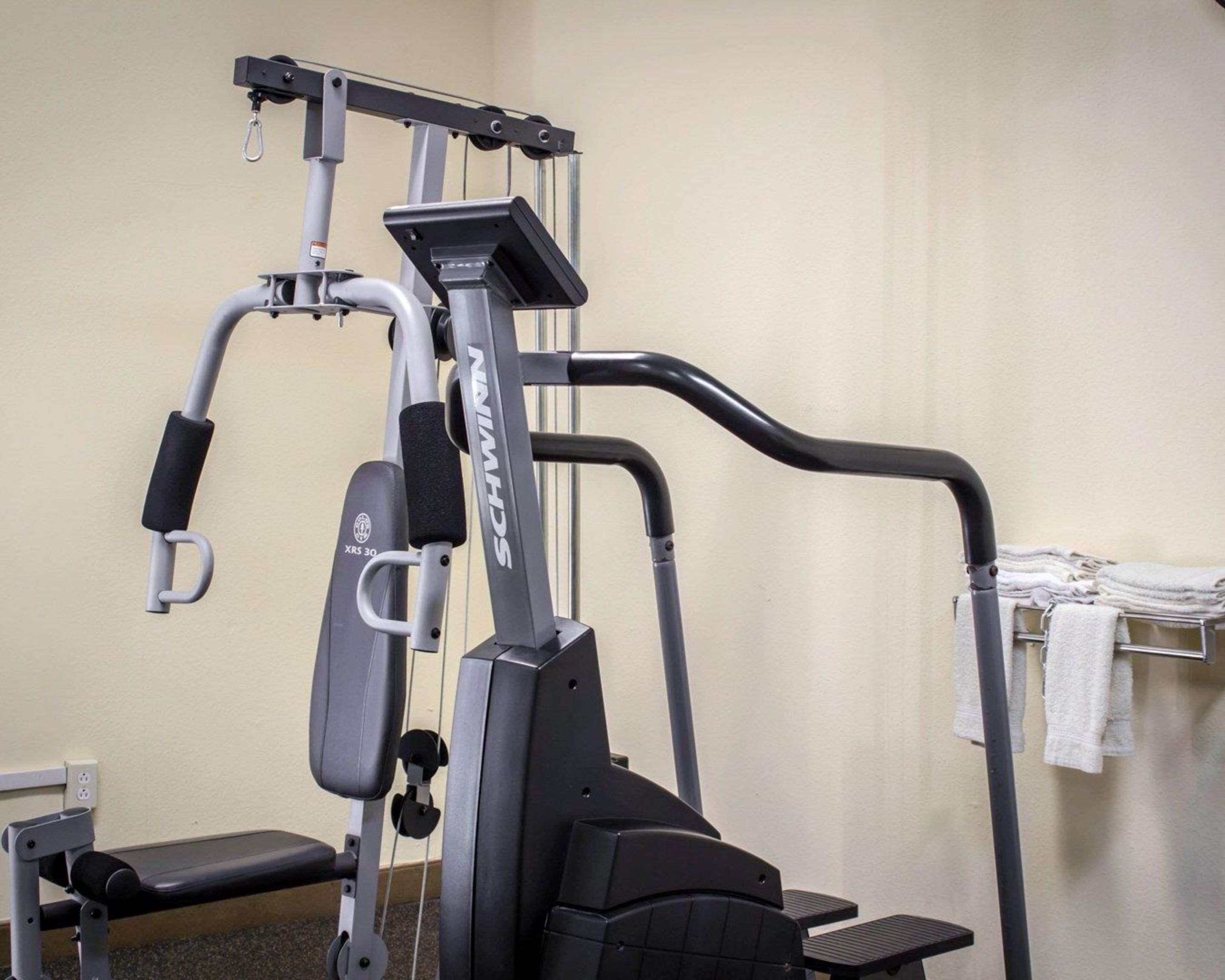 Exercise room with cardio equipment and weights