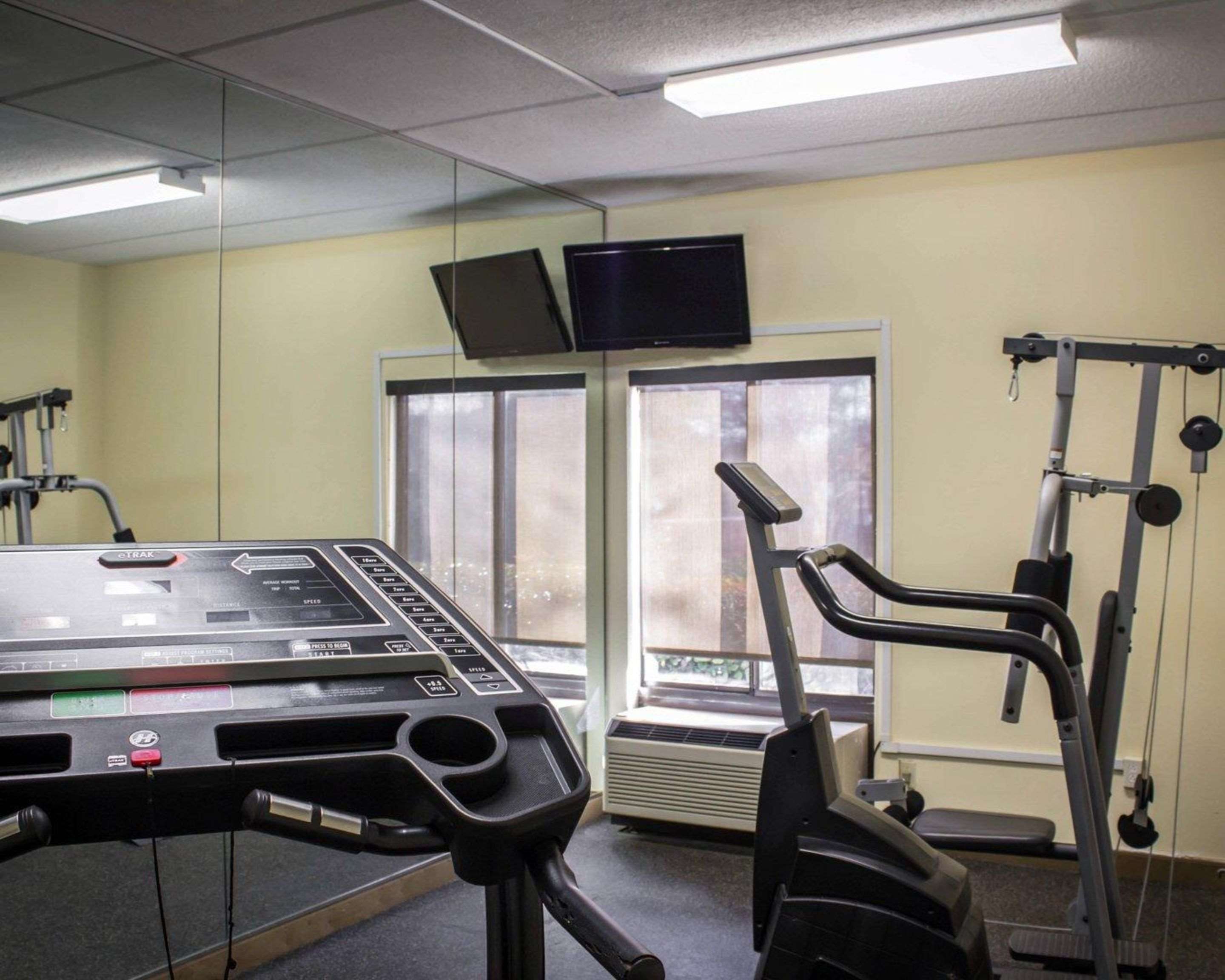 Exercise room with cardio equipment and weights