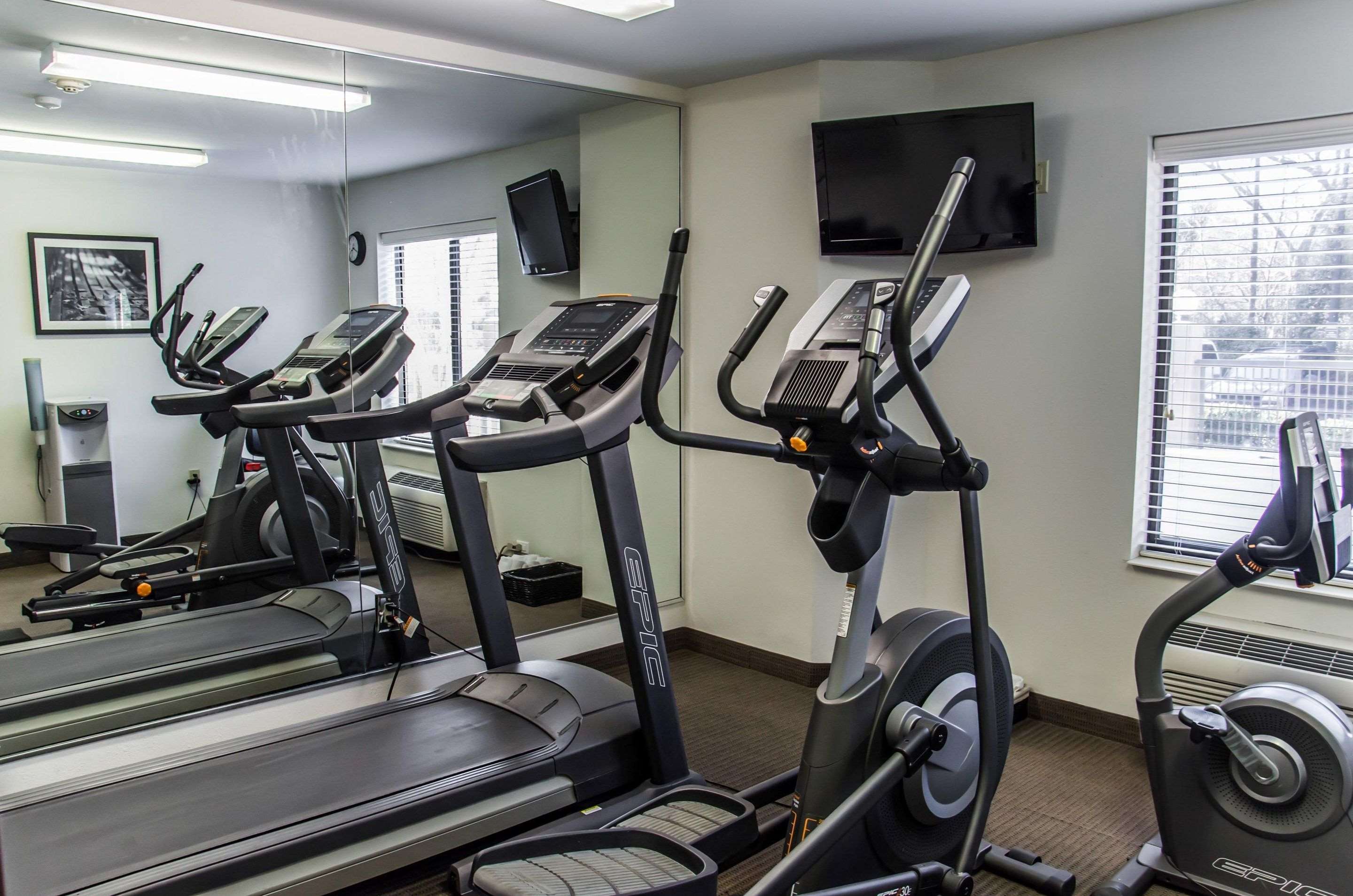 Exercise room with cardio equipment | Sleep Inn Airport - Billy Graham Parkway