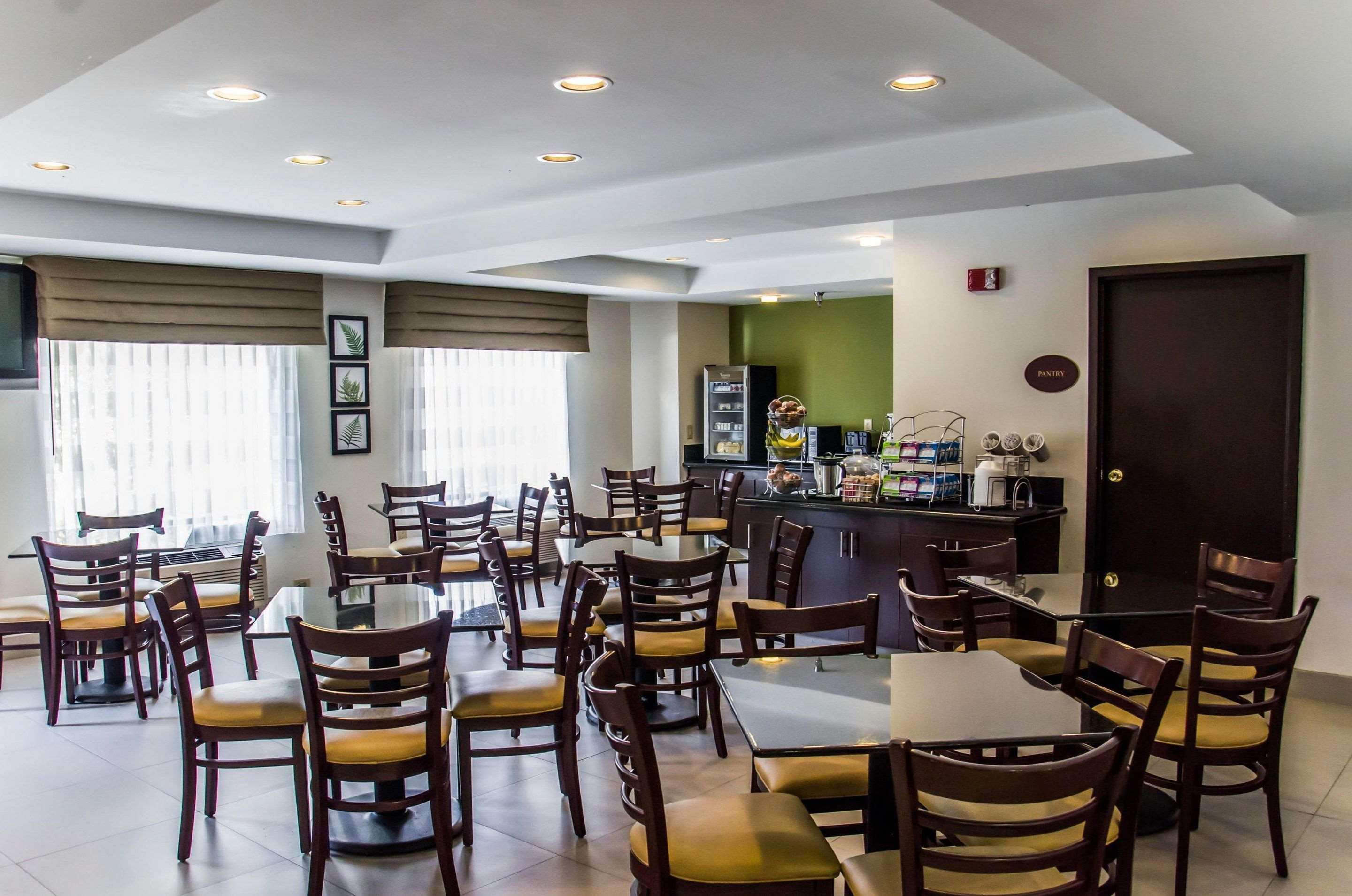 Enjoy breakfast in this seating area | Sleep Inn Airport - Billy Graham Parkway