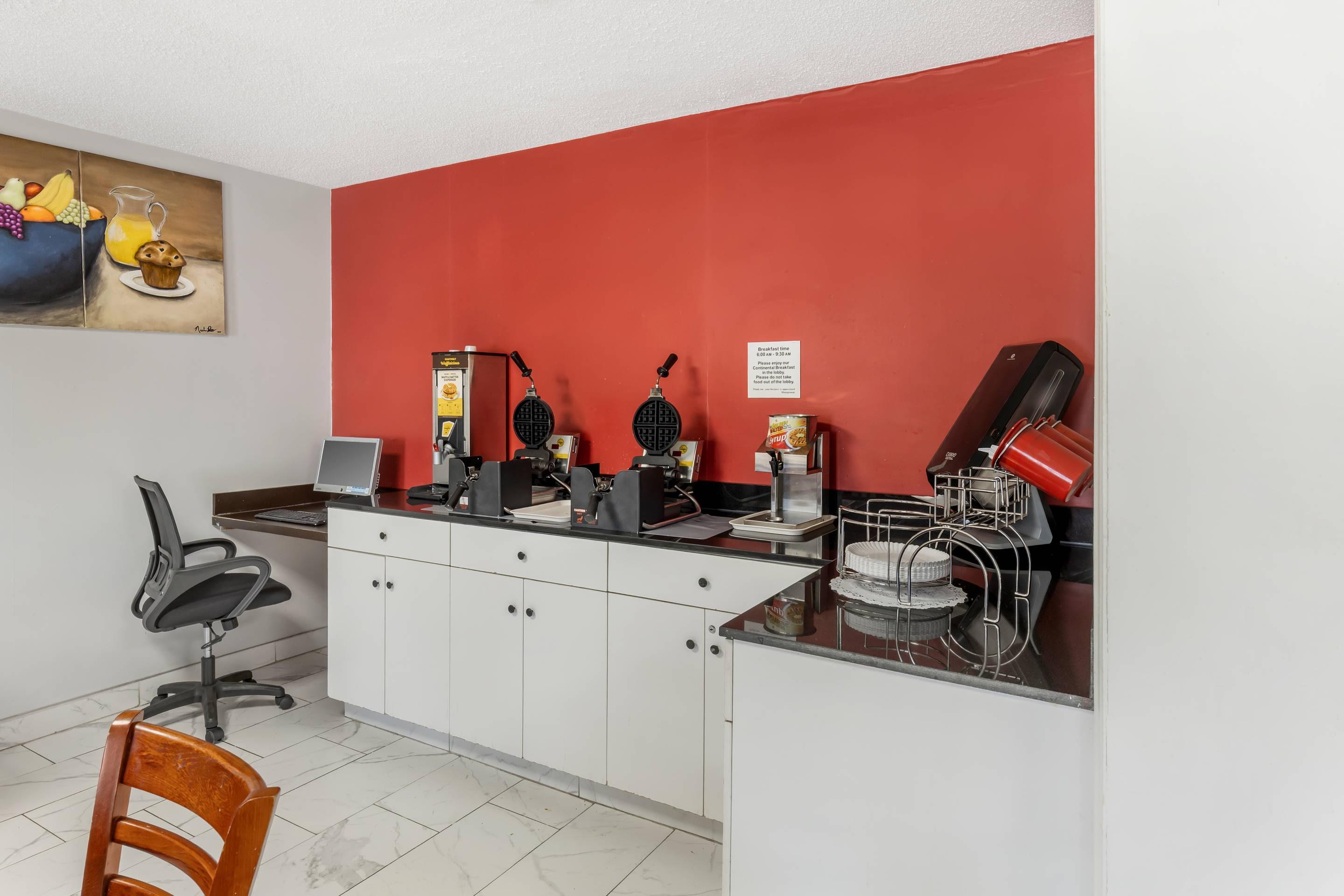 Enjoy breakfast in this seating area | Econo Lodge Research Triangle Park
