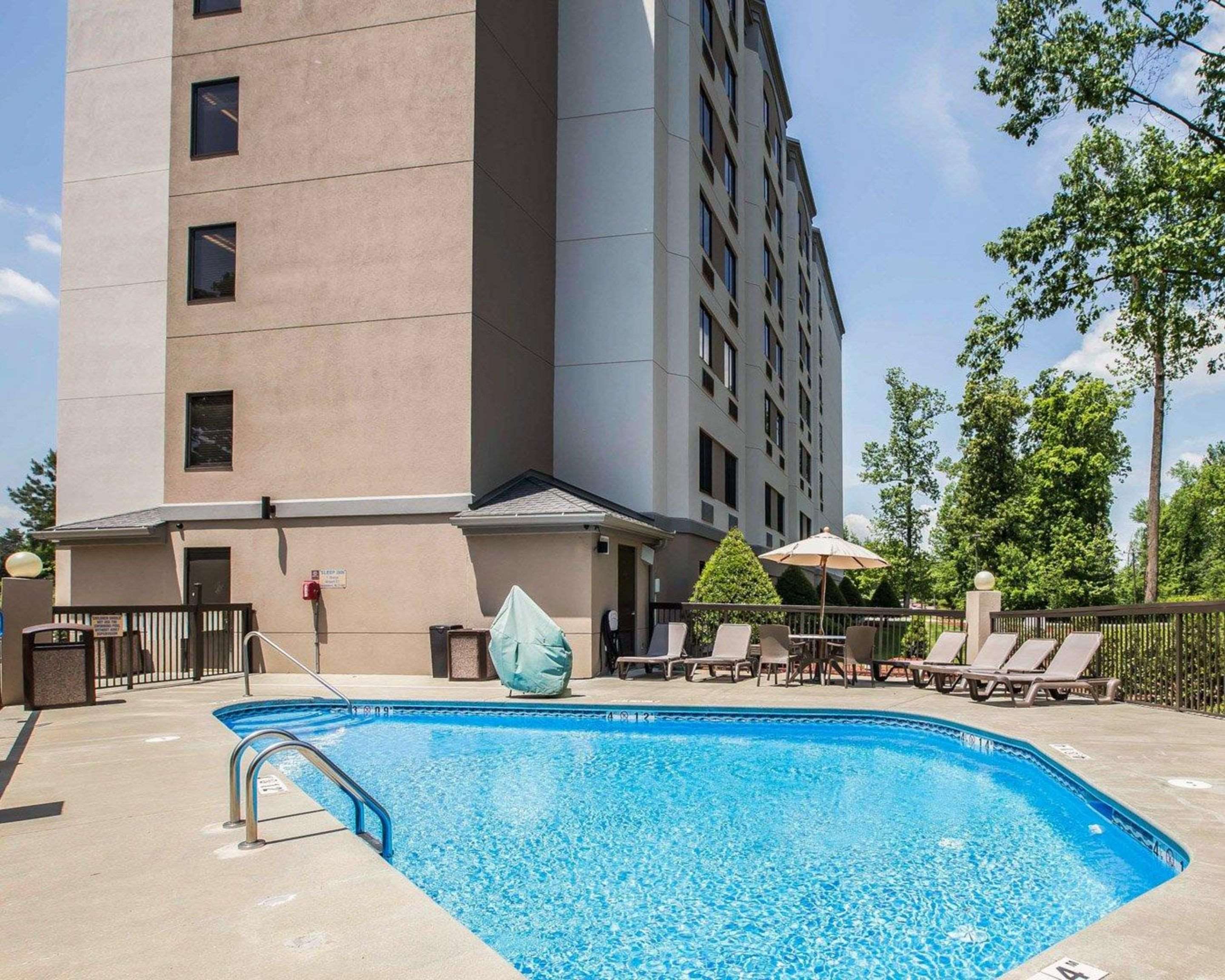Outdoor pool with sundeck | Sleep Inn Airport