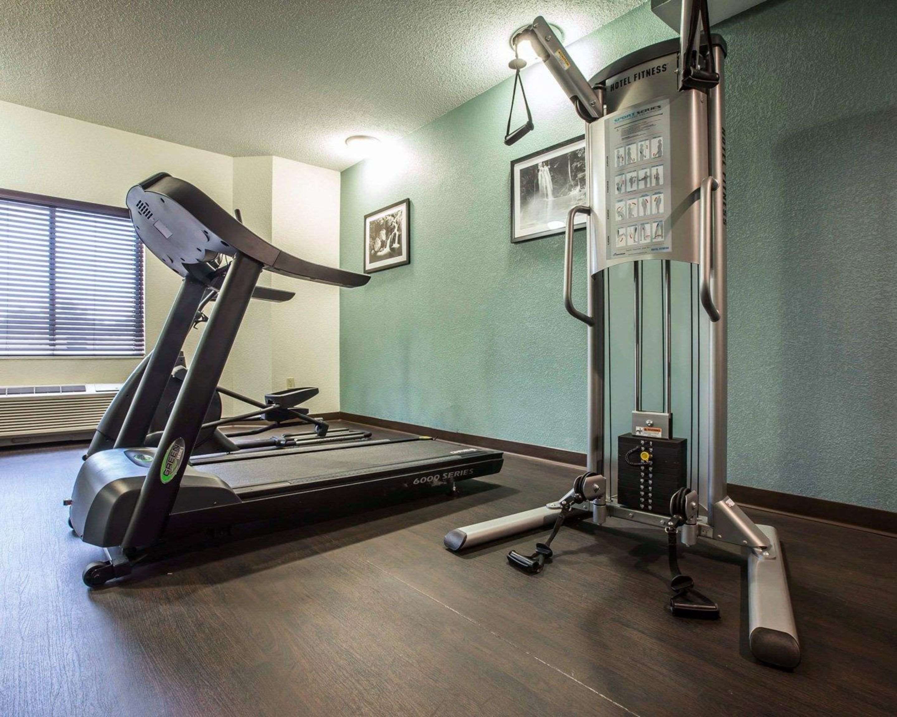 Fitness center with cardio equipment and weights | Sleep Inn Airport