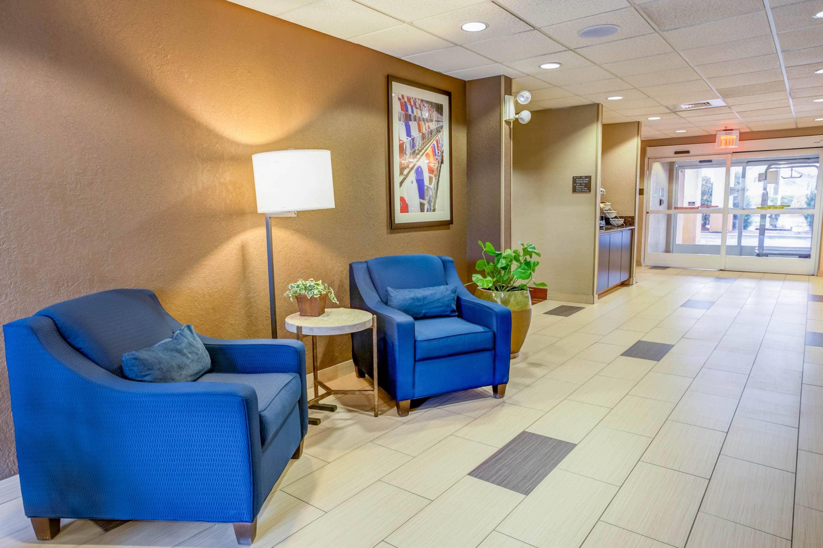 Spacious lobby with sitting area | Comfort Suites Concord Mills