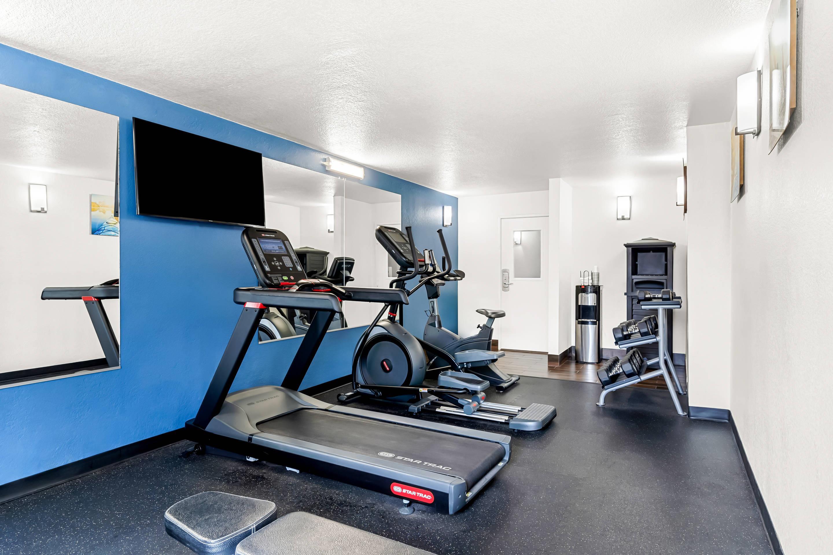 Fitness center with television | Comfort Inn University