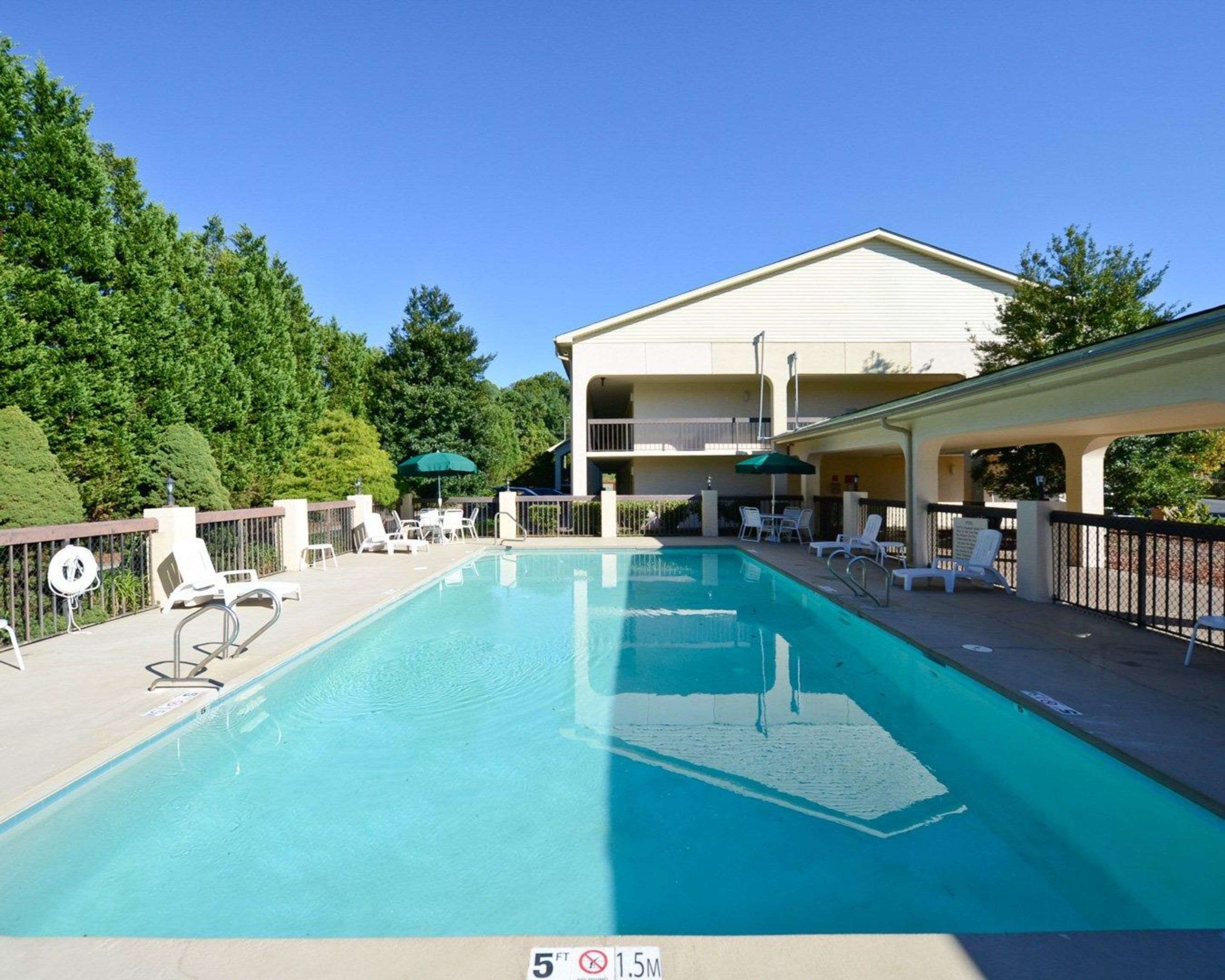 Outdoor pool with sundeck | Quality Inn University Winston Salem
