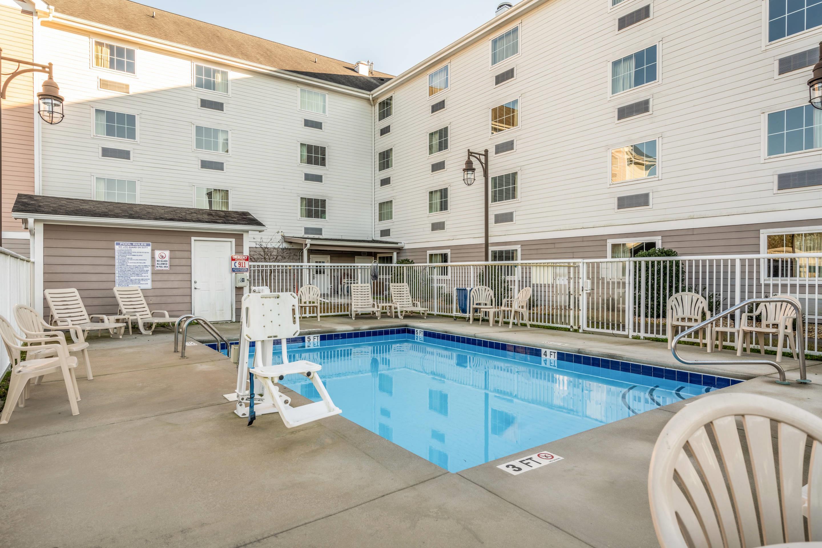 Relax by the pool | Suburban Studios Near Camp Lejeune