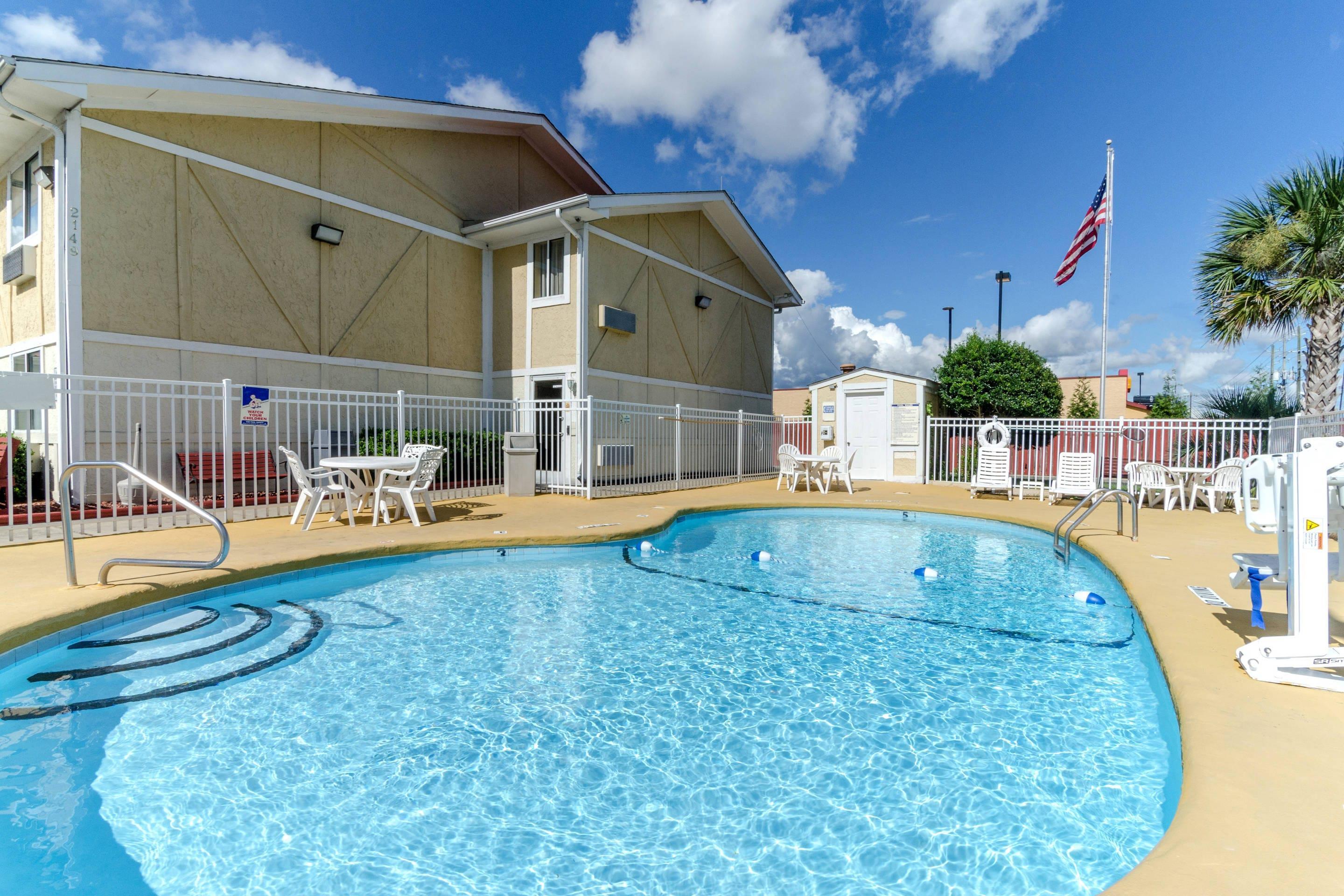 Outdoor pool | Rodeway Inn & Suites Jacksonville near Camp Lejeune