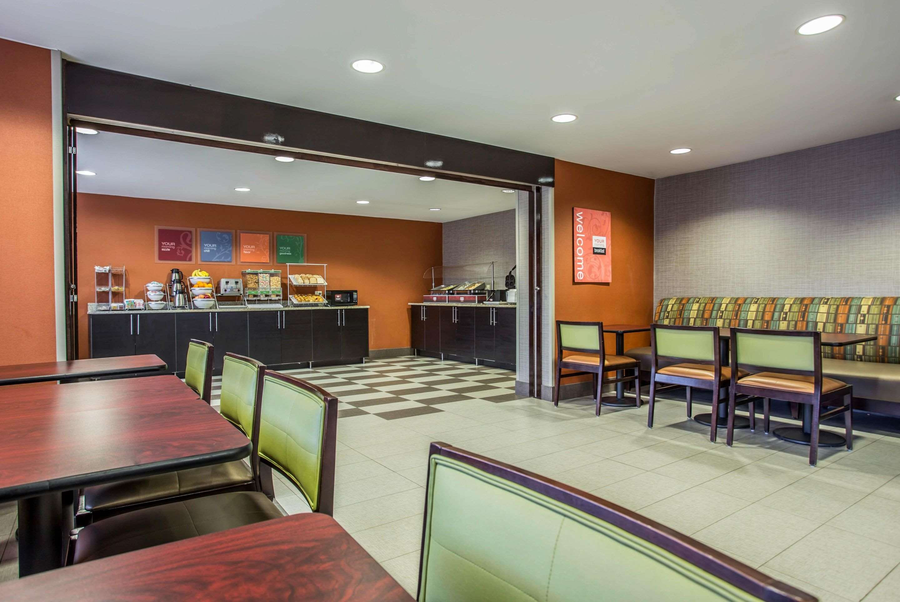 Enjoy breakfast in this seating area | Comfort Inn & Suites Kannapolis - Concord