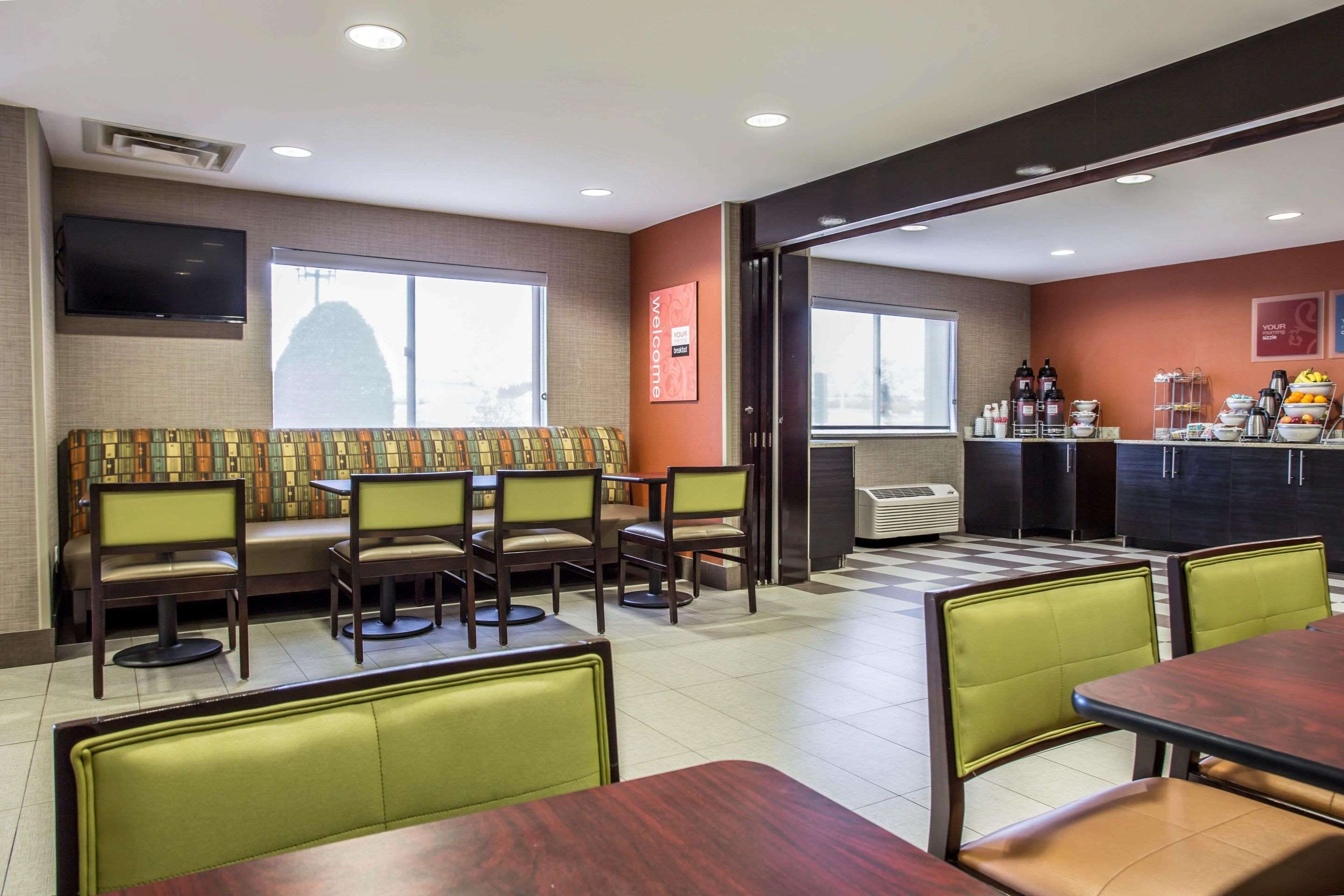 Enjoy breakfast in this seating area | Comfort Inn & Suites Kannapolis - Concord