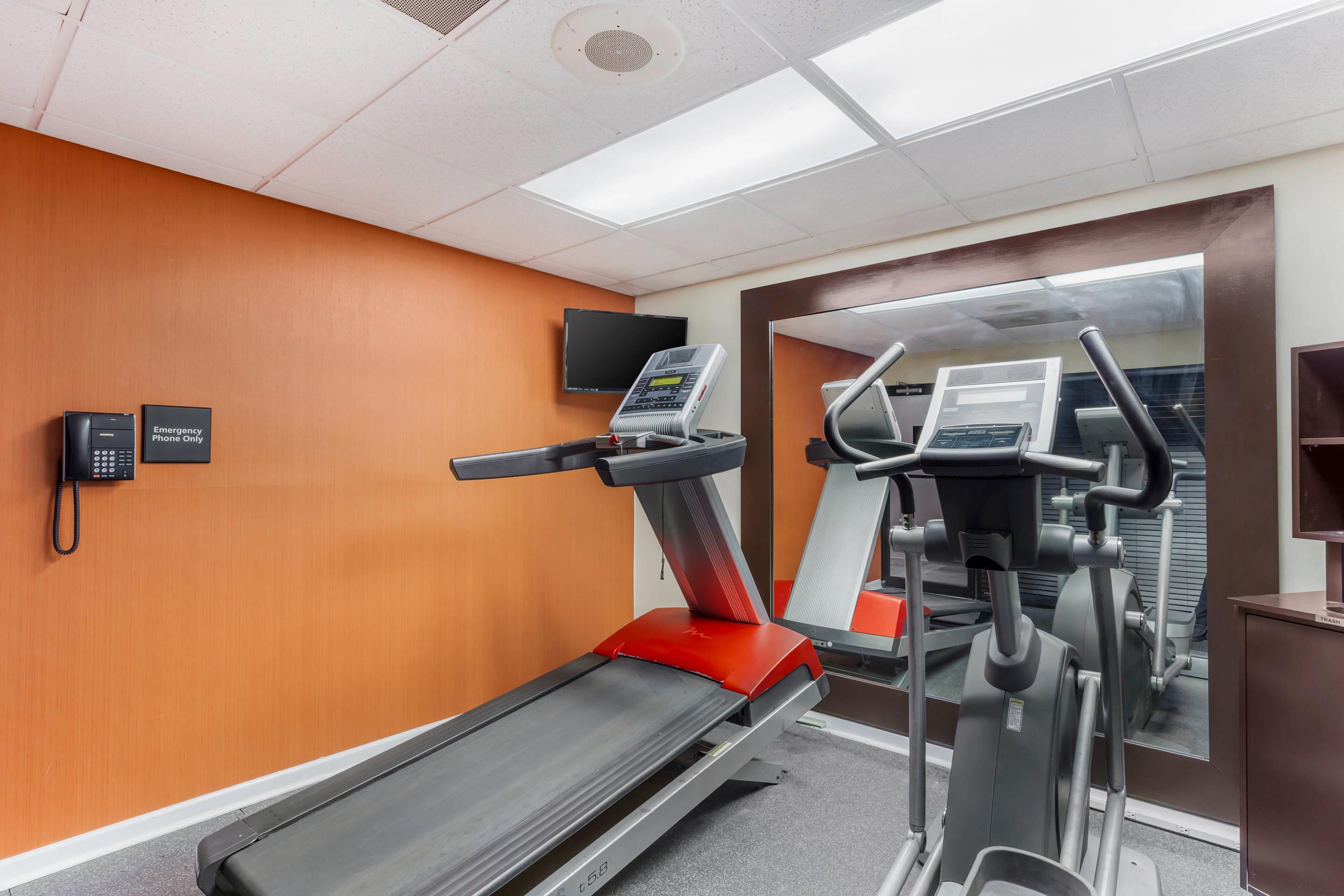 Exercise room with cardio equipment | Quality Inn