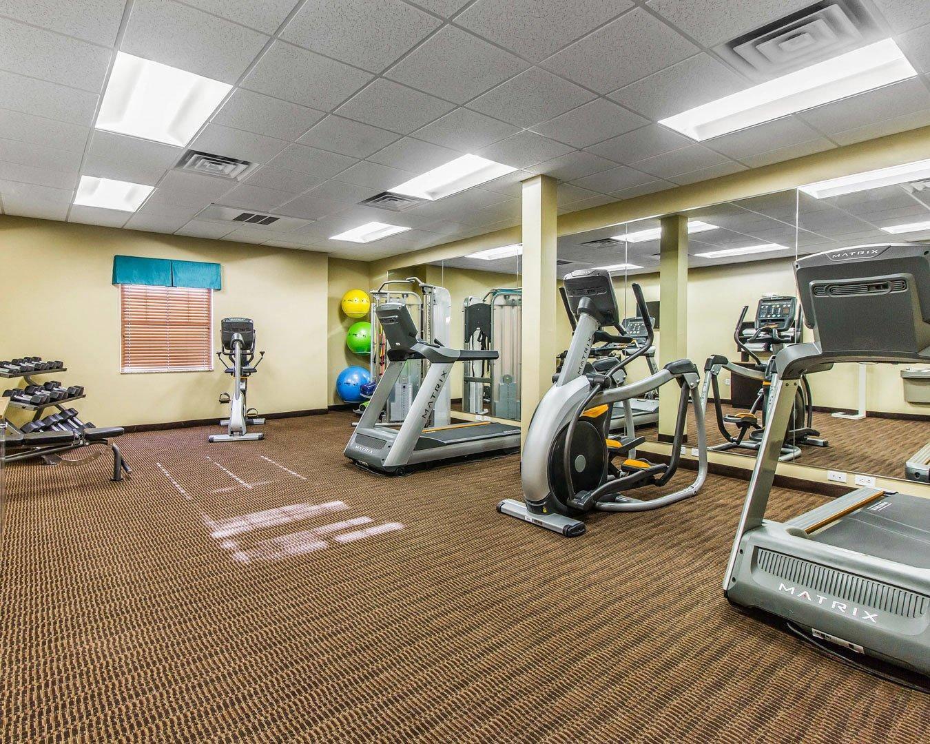Fitness center with cardio equipment and weights | MainStay Suites Watford City - Event Center