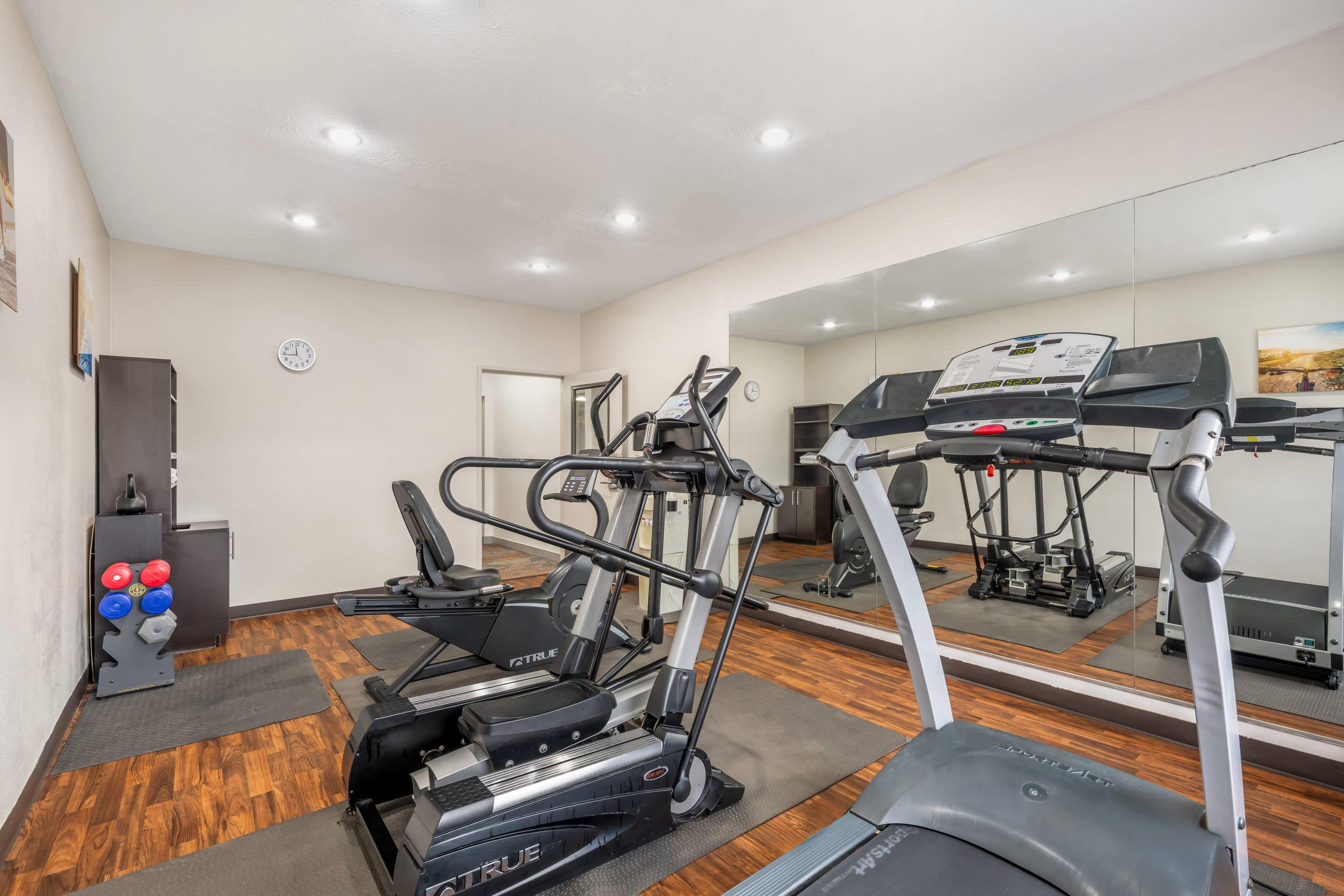 Exercise room with cardio equipment and weights | Comfort Suites Omaha Northwest