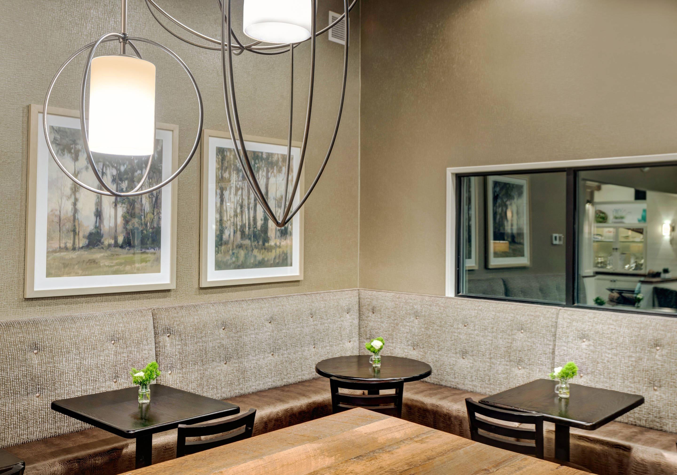 Enjoy breakfast in this seating area | The Garrison Hotel & Suites Dover - Durham, Ascend Hotel Collection
