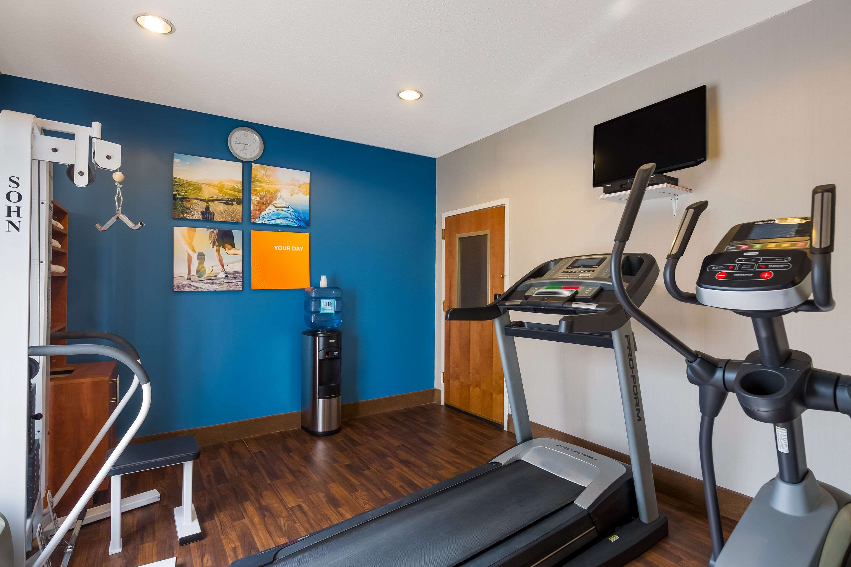 Exercise room with cardio equipment and weights