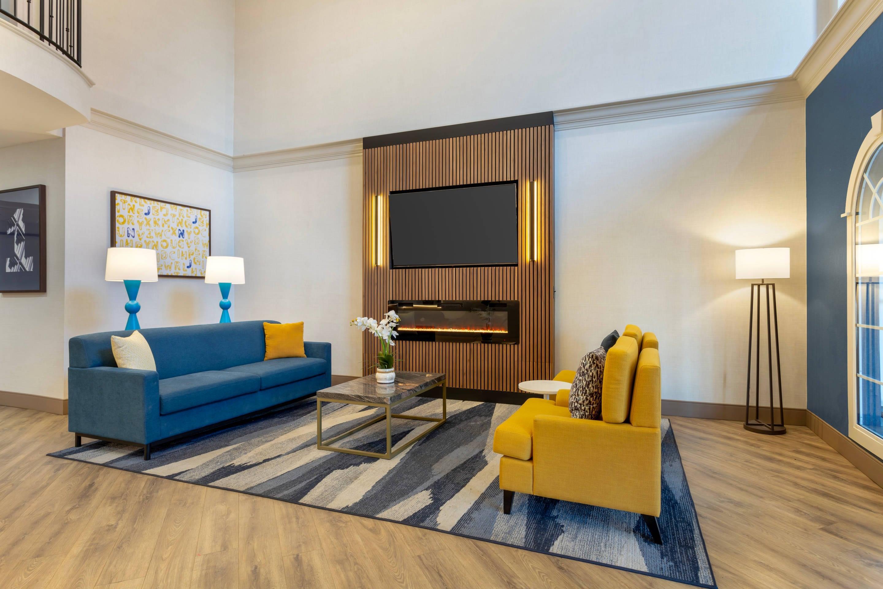 Spacious lobby with sitting area | Comfort Suites East Brunswick - South River