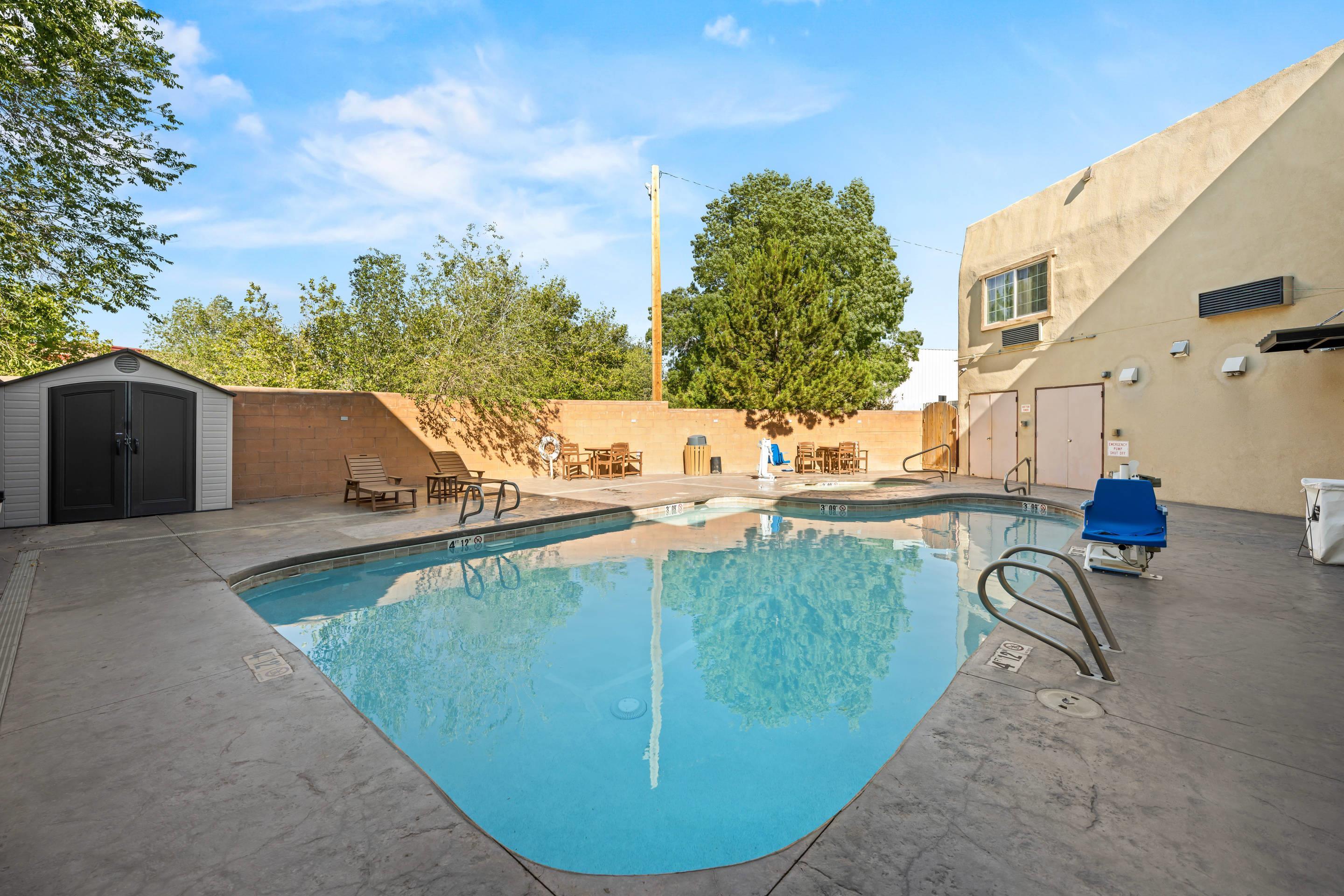 Outdoor pool | Econo Lodge Inn & Suites
