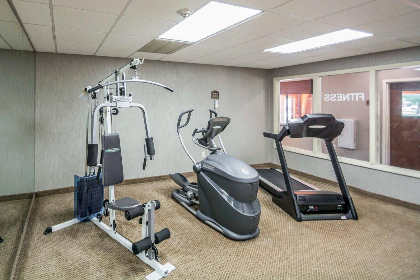 Exercise room with cardio equipment and weights