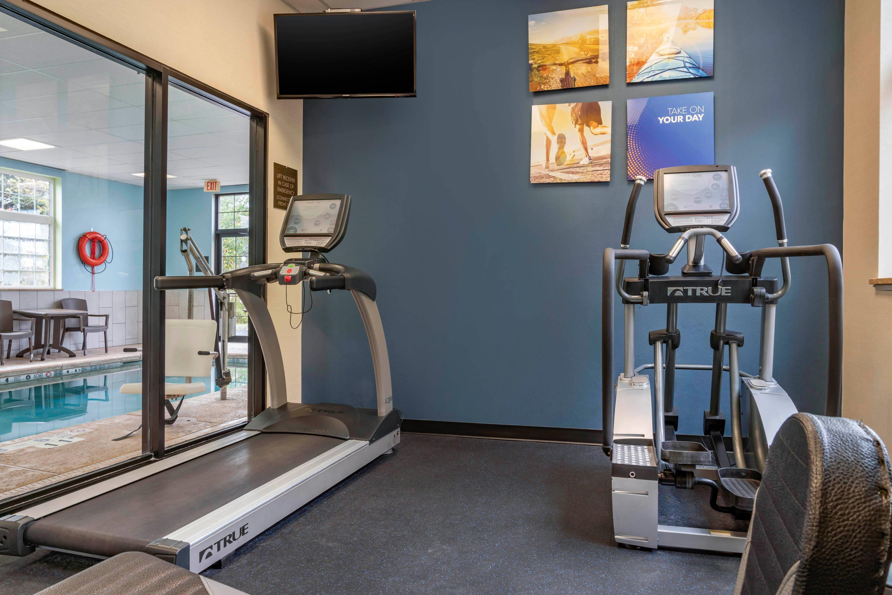 Exercise room with cardio equipment | Comfort Inn University