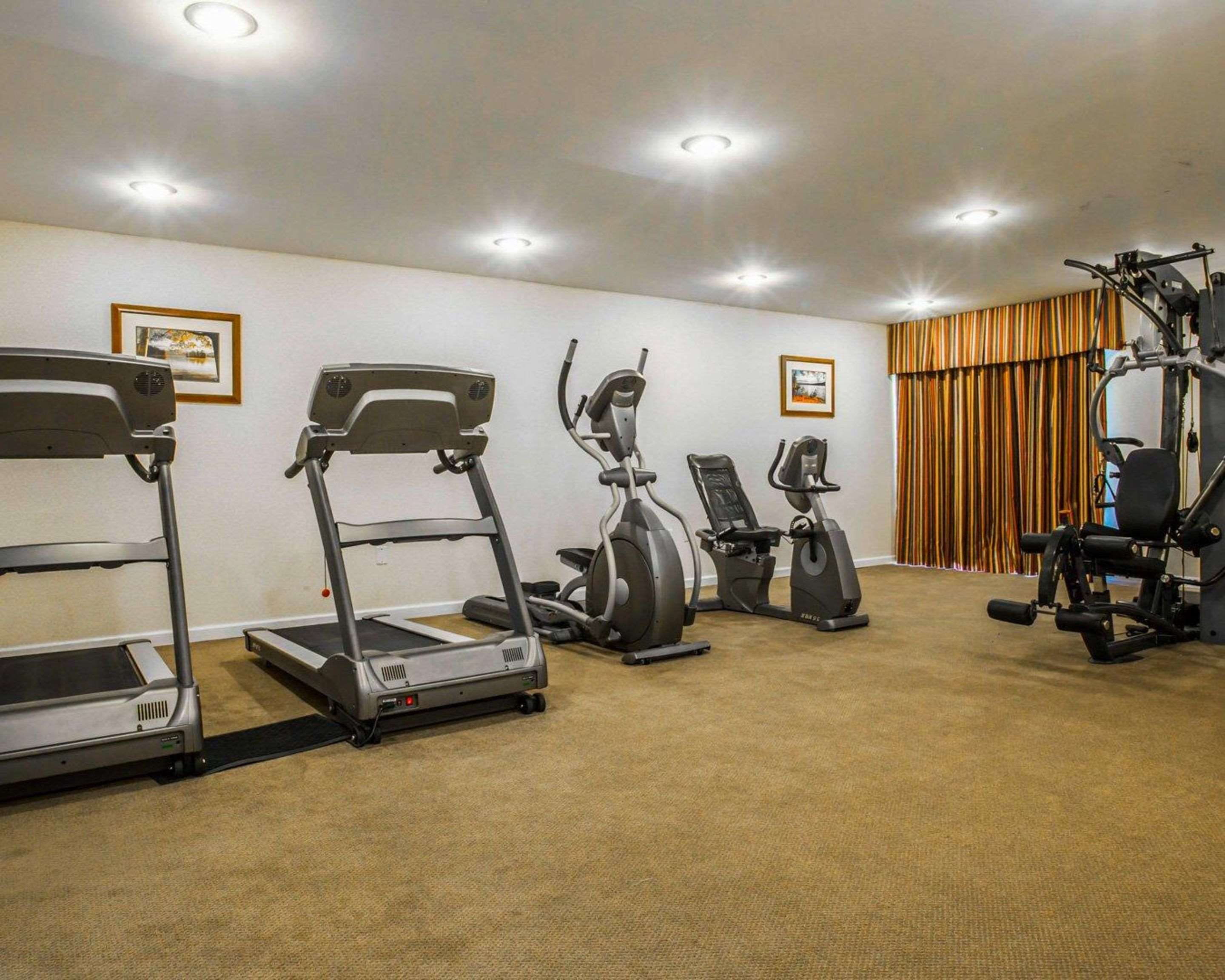 Fitness center with cardio equipment and weights | Clarion Inn & Suites at the Outlets of Lake George