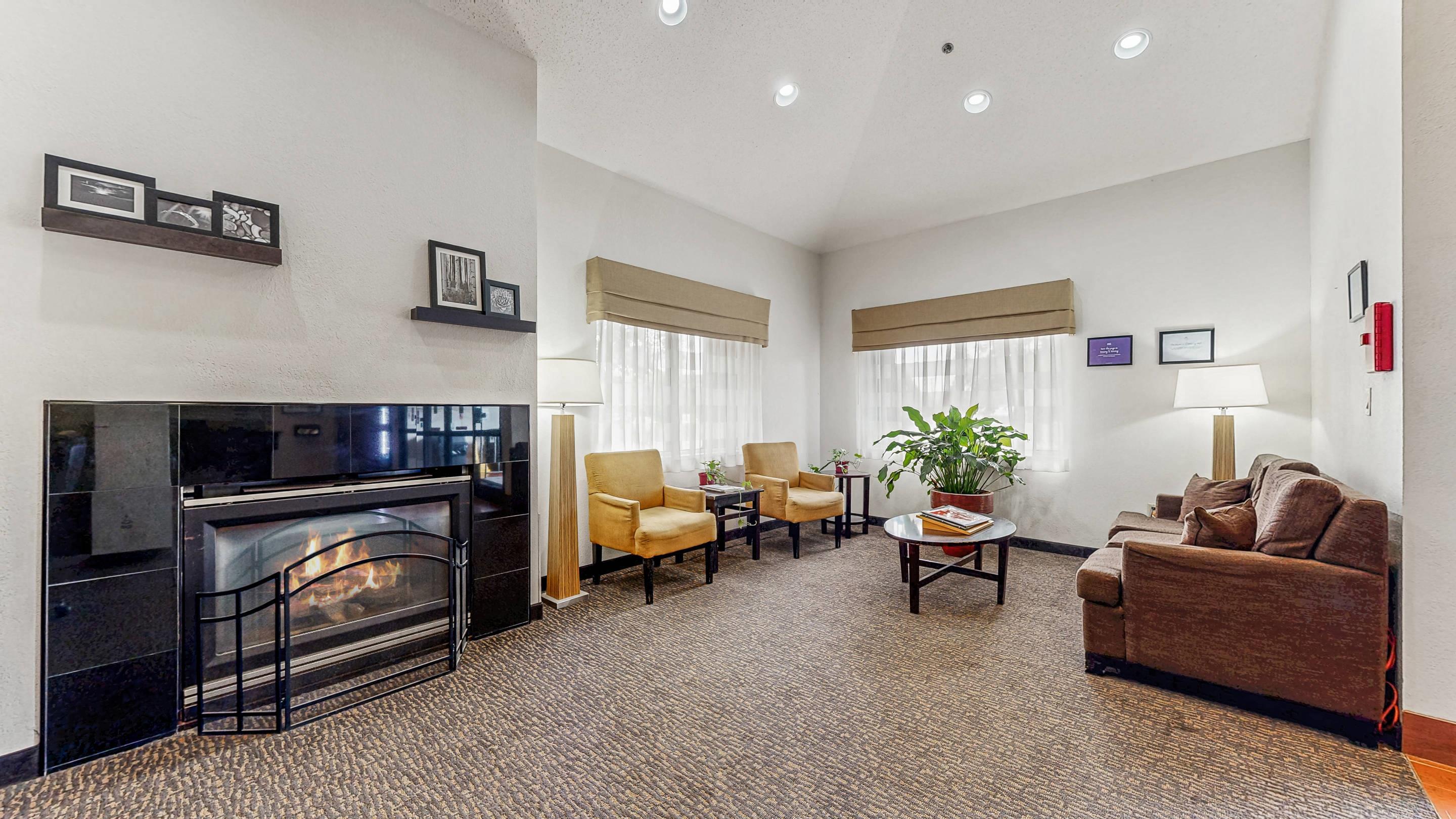 Spacious lobby with sitting area | Sleep Inn & Suites Buffalo Airport