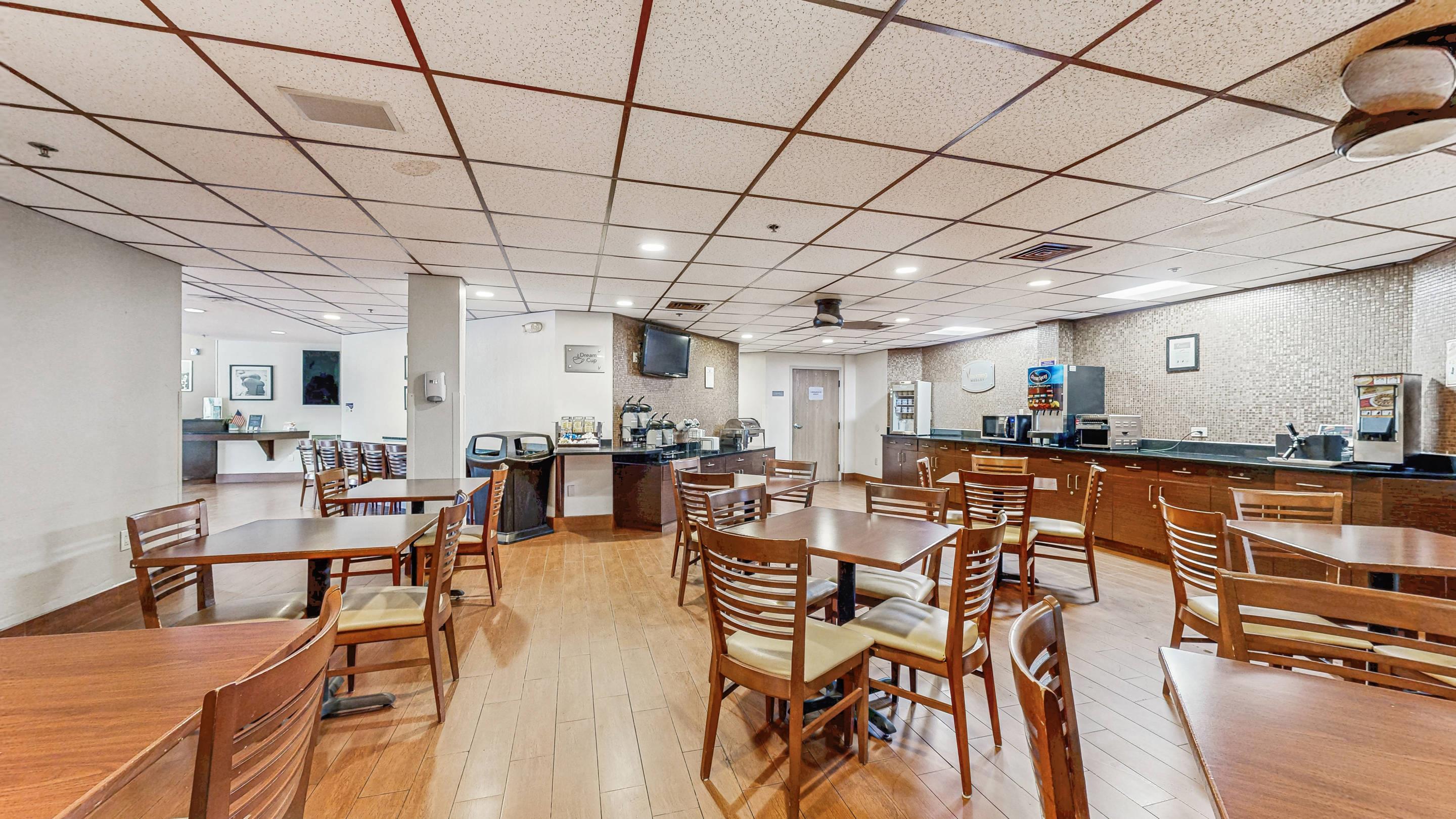 Enjoy breakfast in this seating area | Sleep Inn & Suites Buffalo Airport