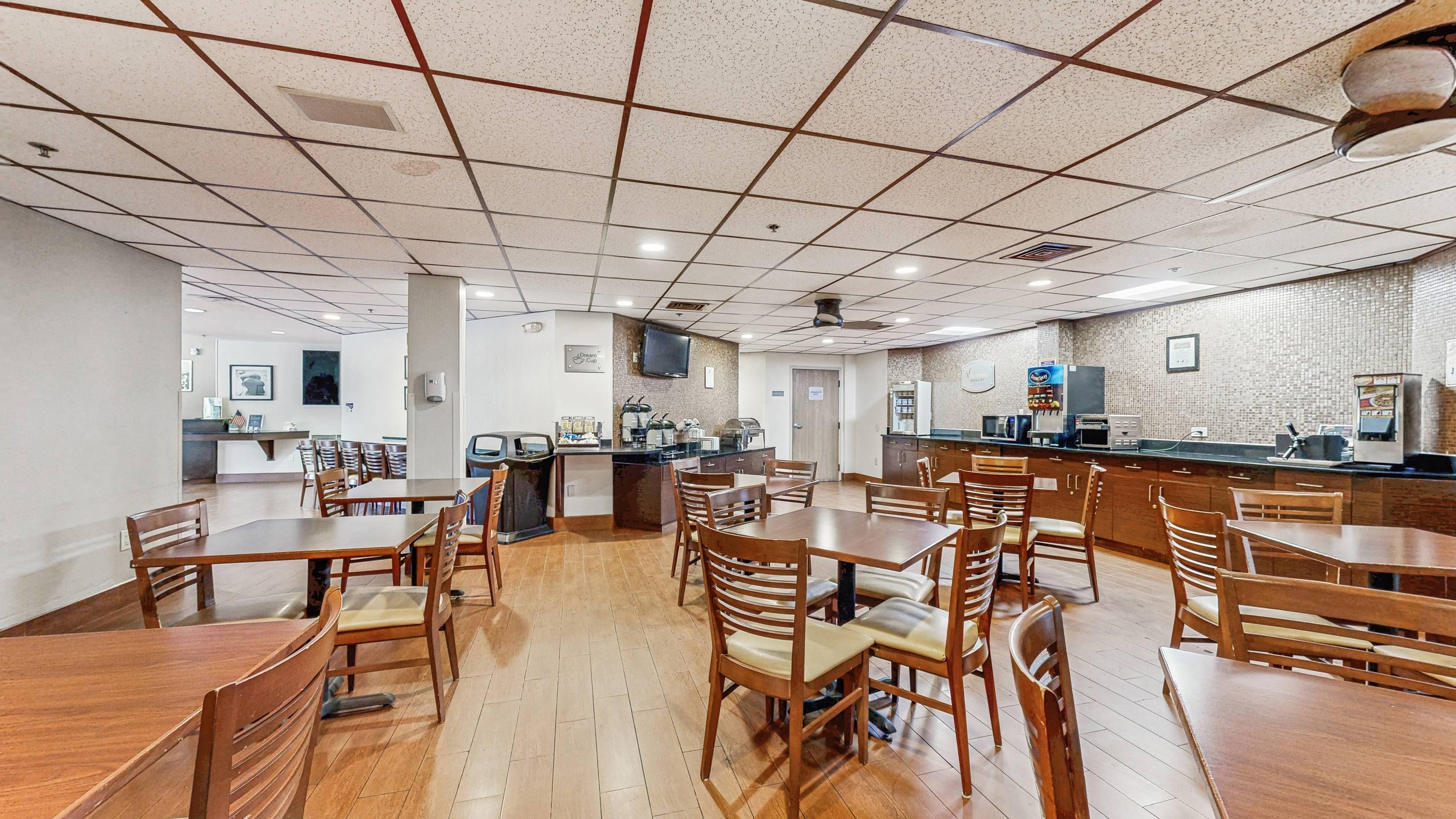 Enjoy breakfast in this seating area | Sleep Inn & Suites Buffalo Airport