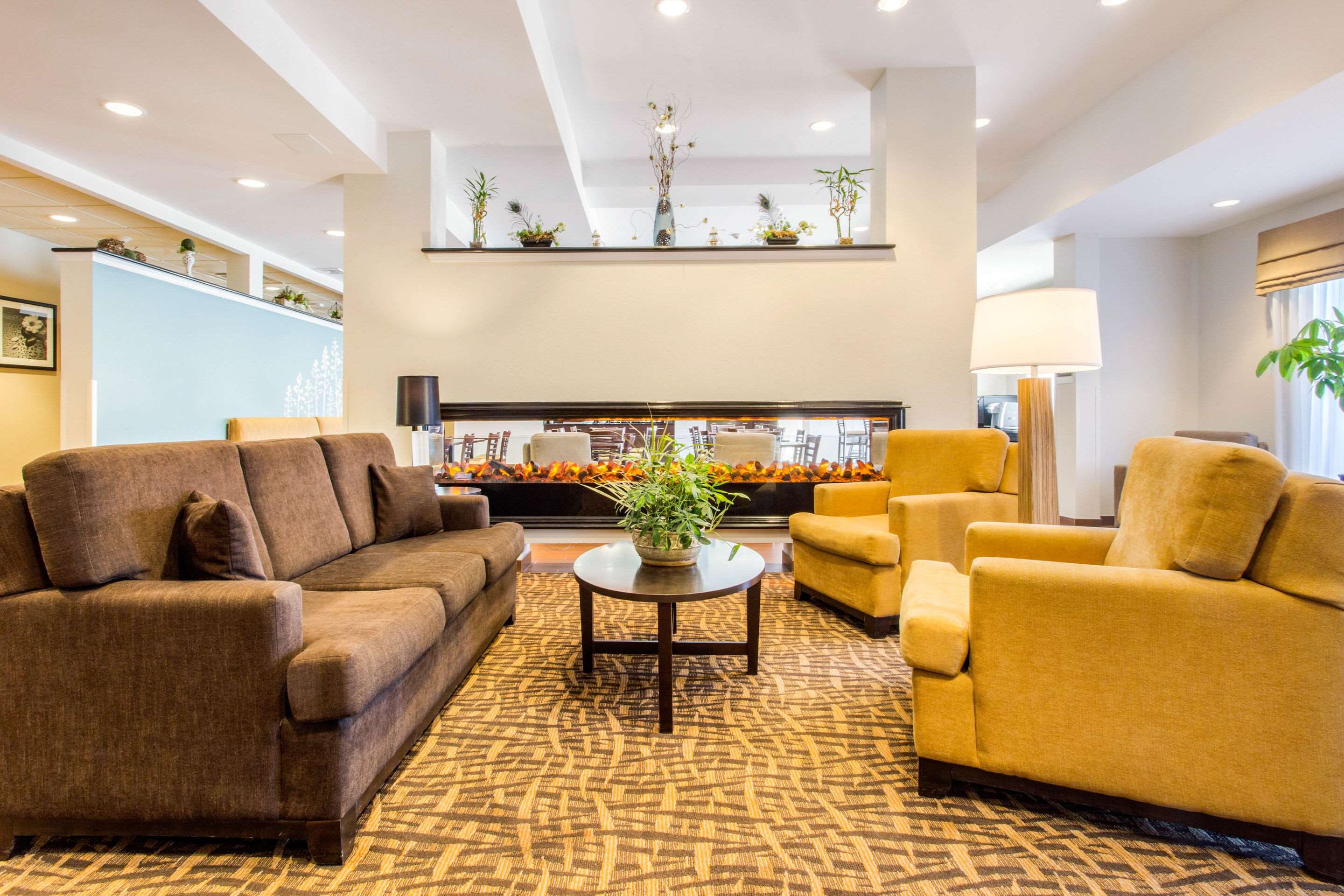 Spacious lobby with sitting area | Sleep Inn & Suites Middletown - Goshen