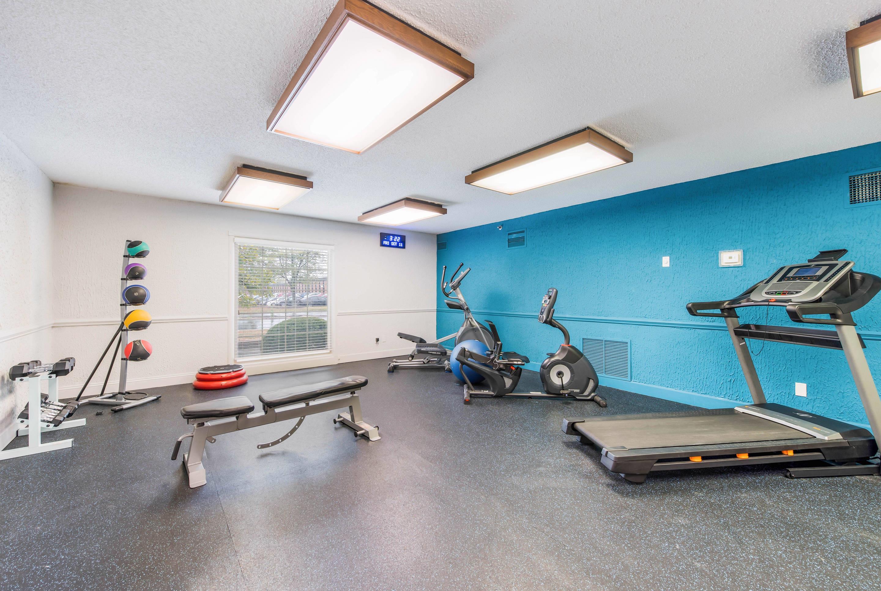 Exercise room with cardio equipment and weights | The Blu Hotel Blue Ash Cincinnati, Ascend Hotel Collection