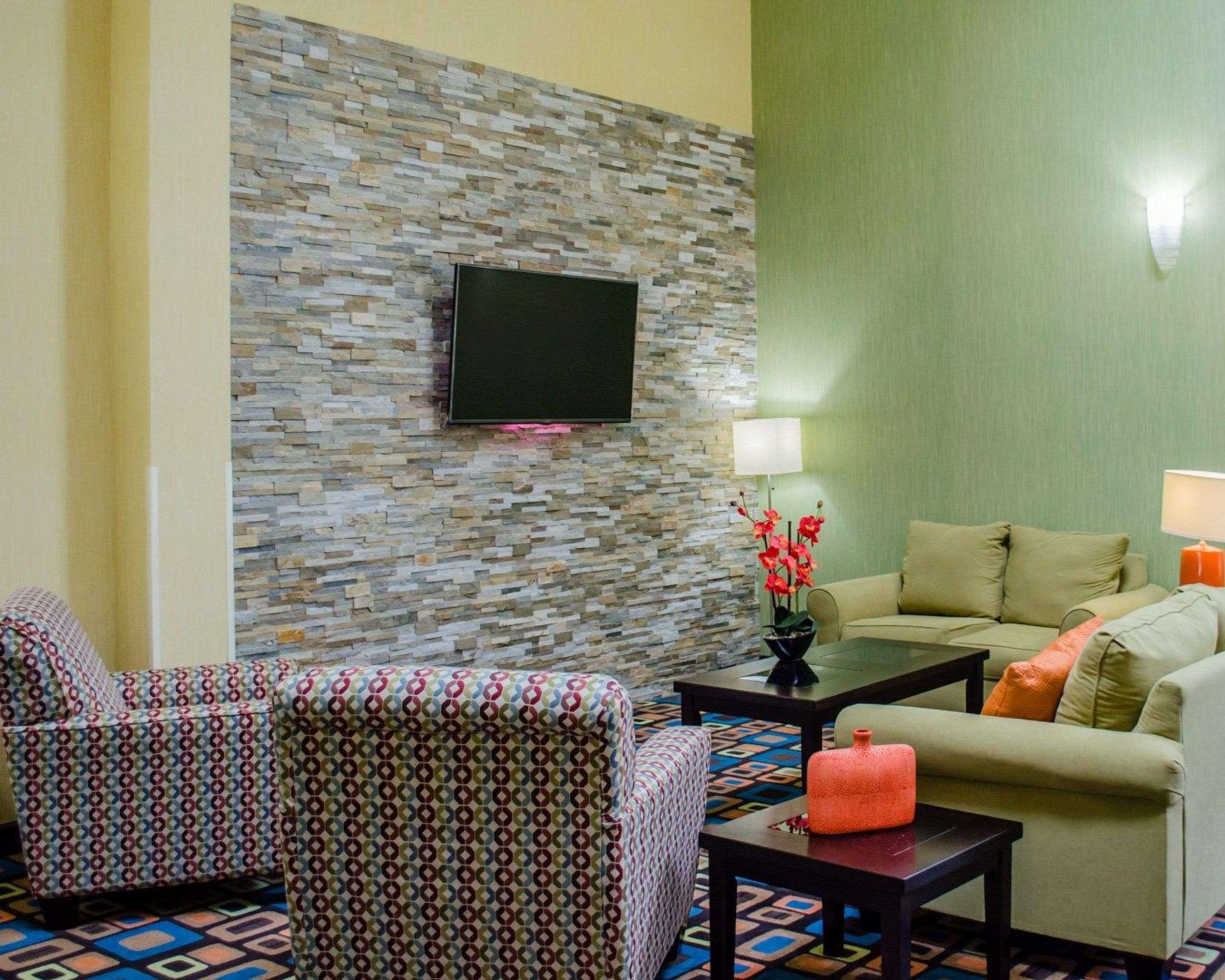 Spacious lobby with sitting area | Quality Inn & Suites Medina - Akron West