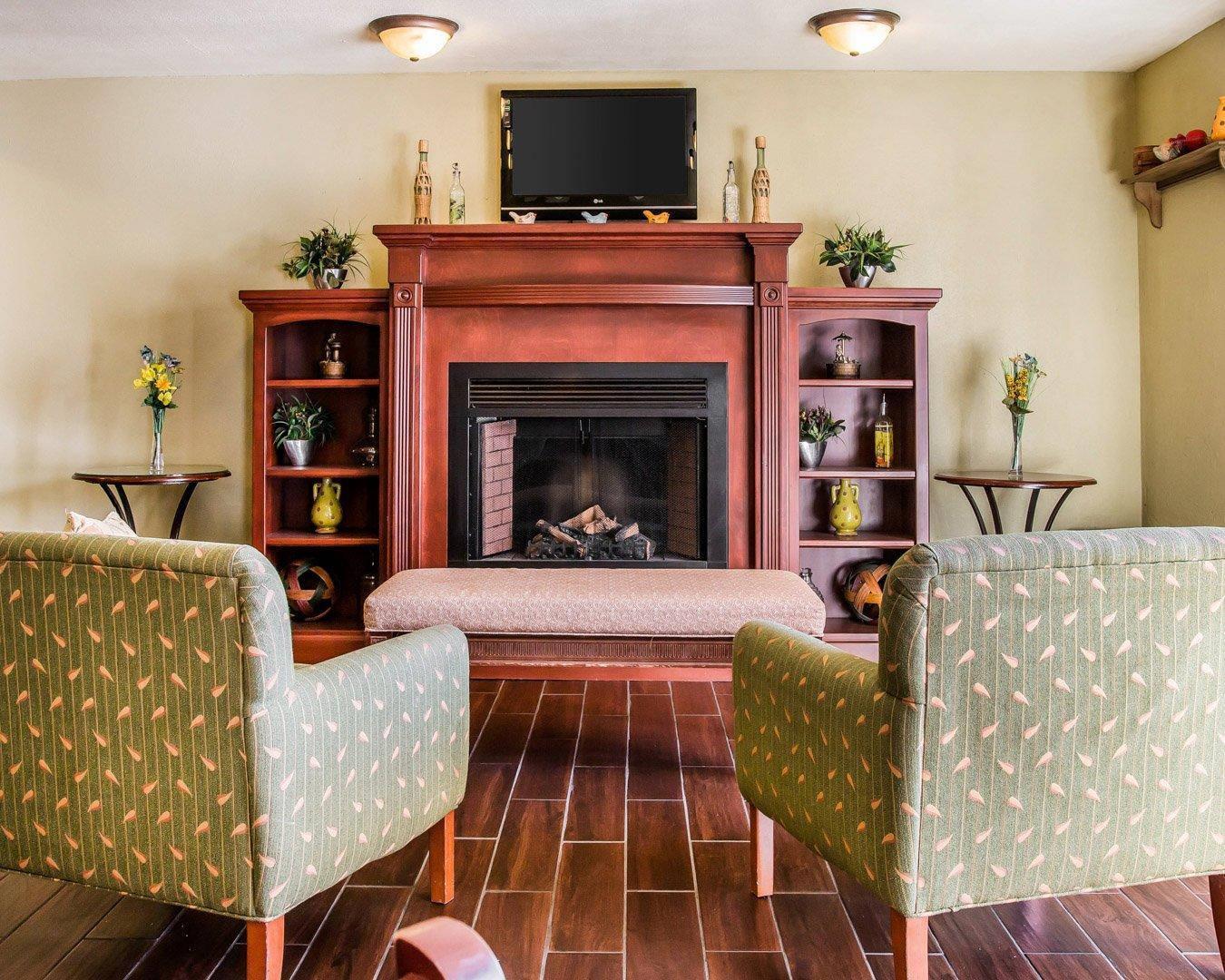 Relax by the fireplace in the lobby | Quality Inn Holland