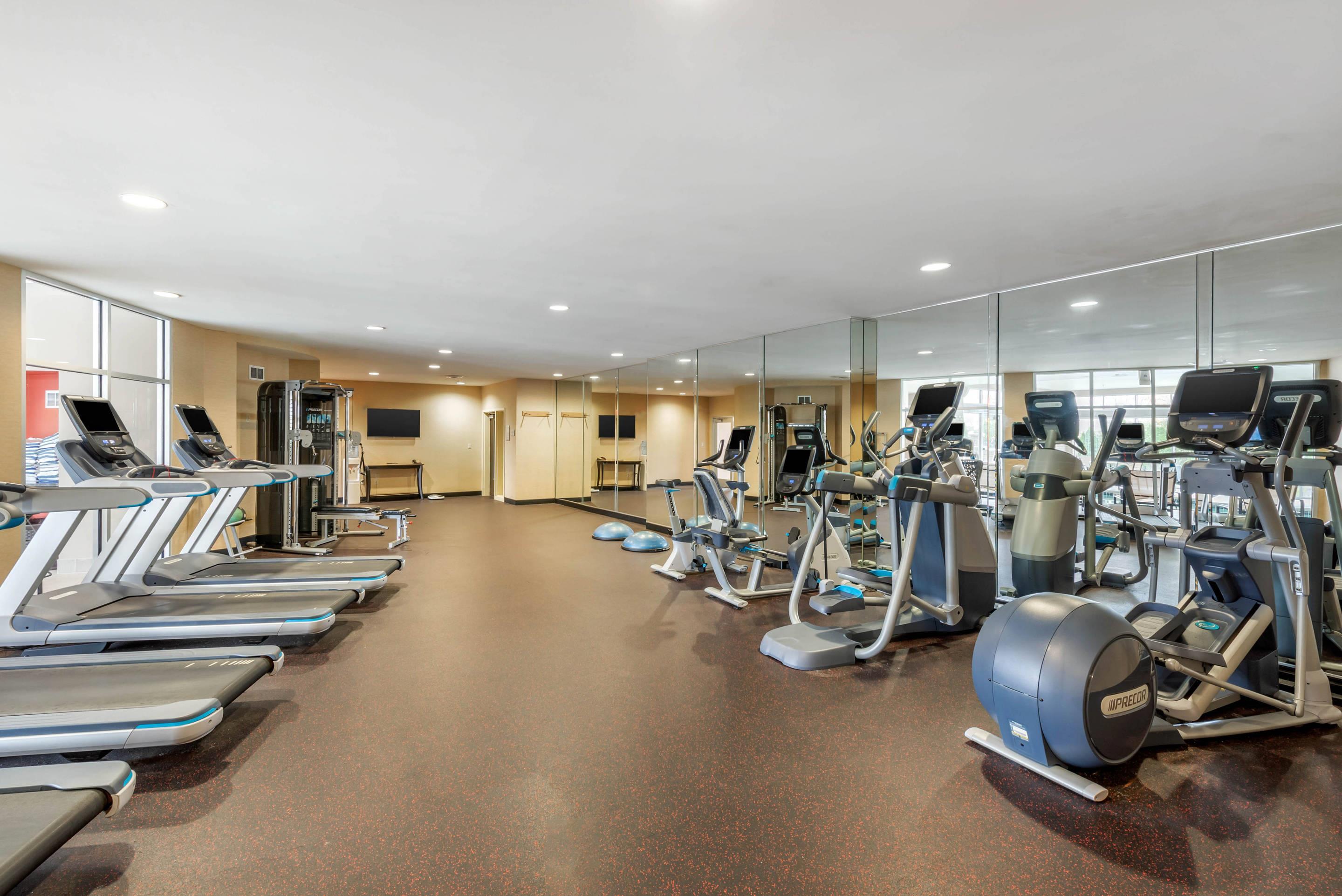 Exercise room with cardio equipment and weights