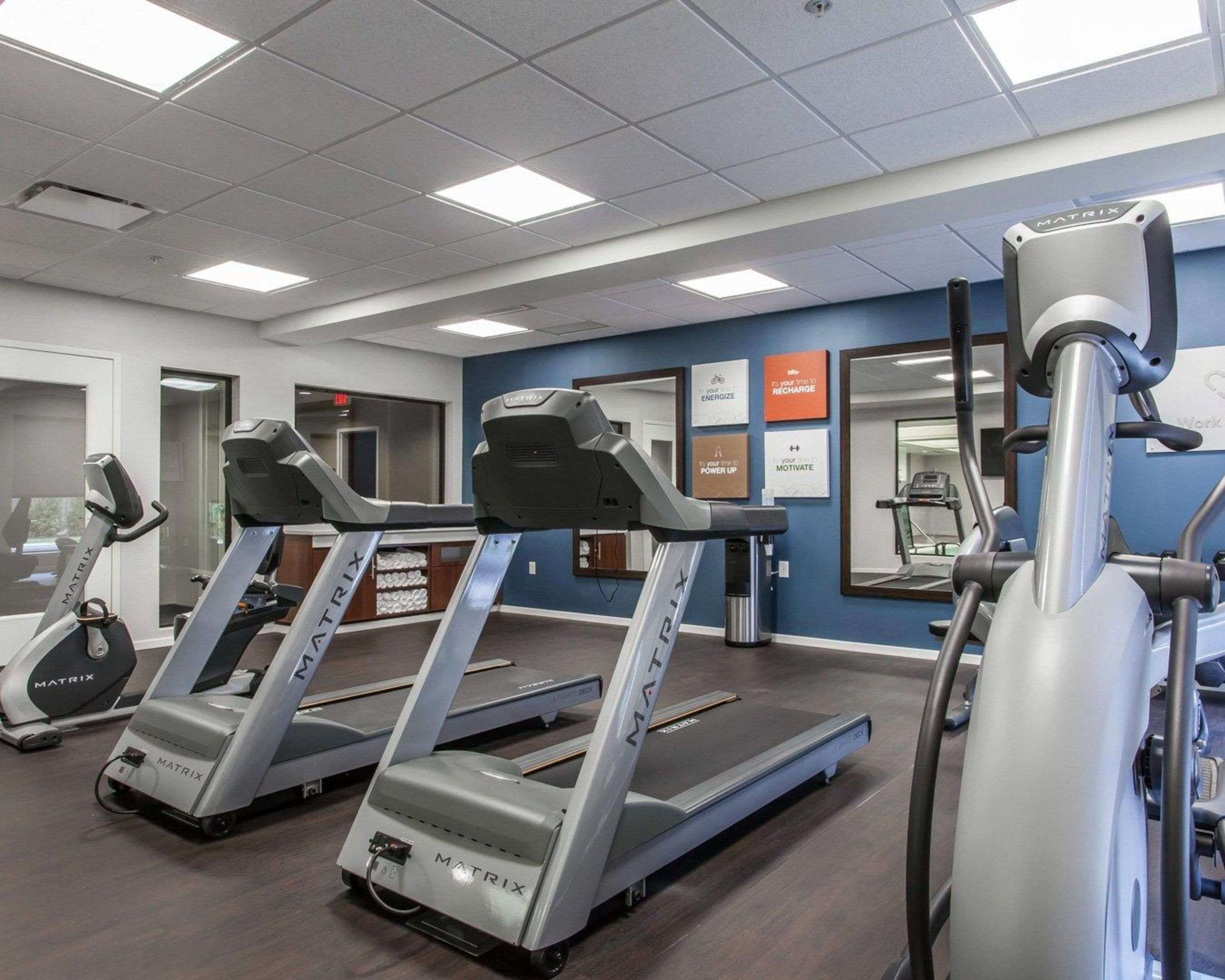 Fitness center with cardio equipment and weights | Comfort Suites Youngstown North