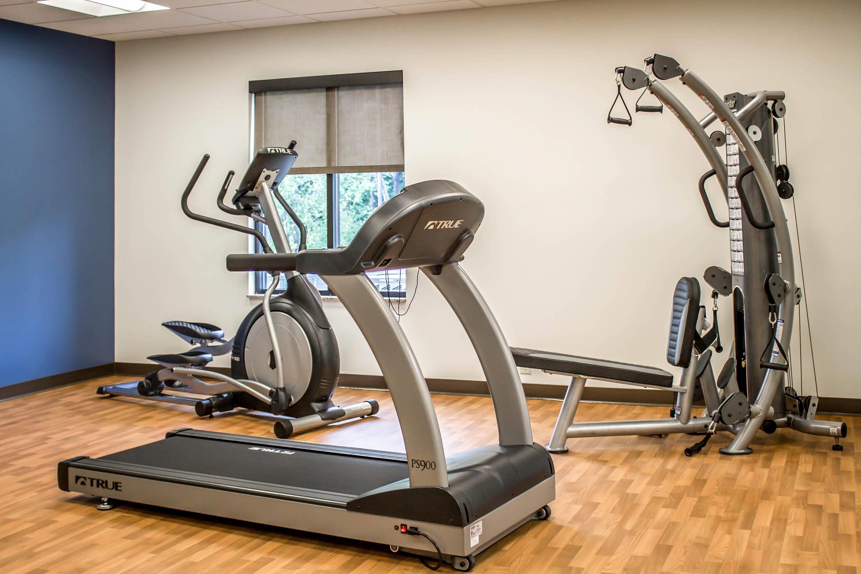 Exercise room with cardio equipment and weights
