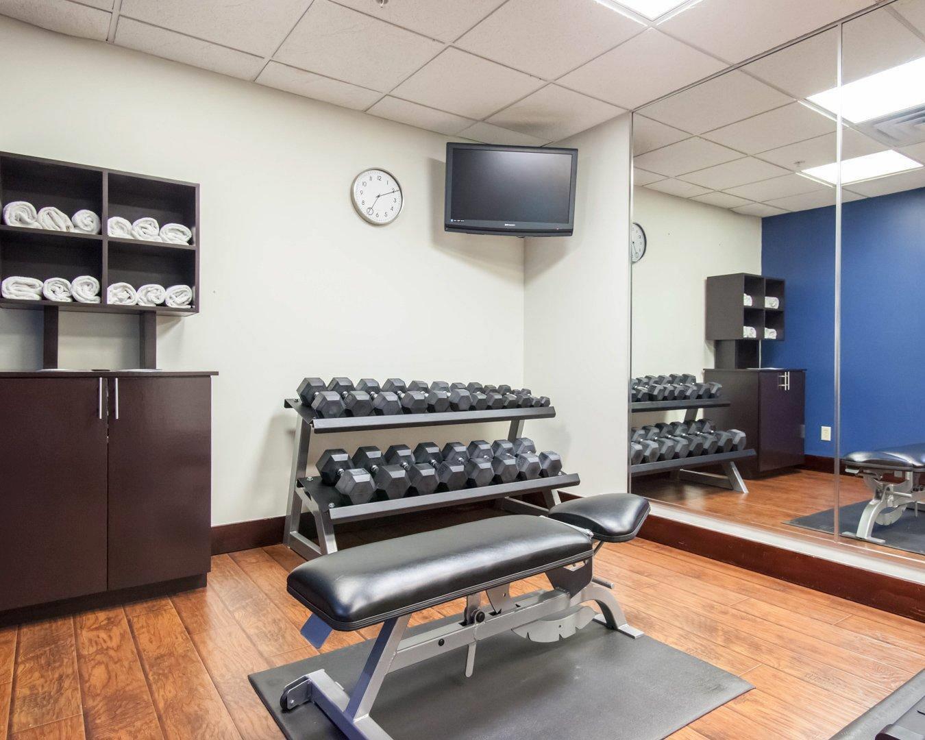 Exercise room with free weights | Comfort Suites Central/I-44