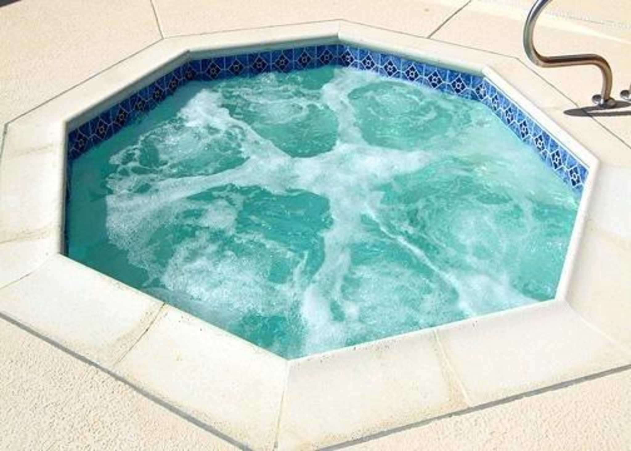 Relax in the hot tub | Comfort Suites Idabel