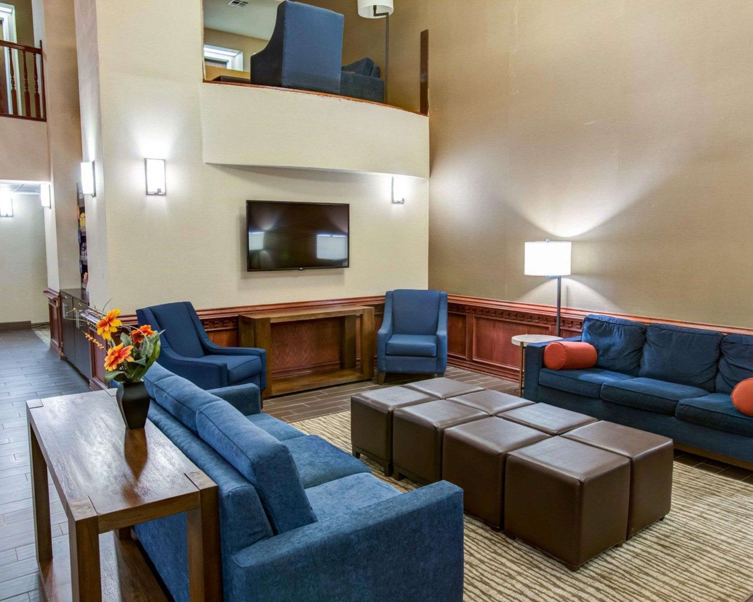 Spacious lobby with sitting area | Comfort Suites Idabel