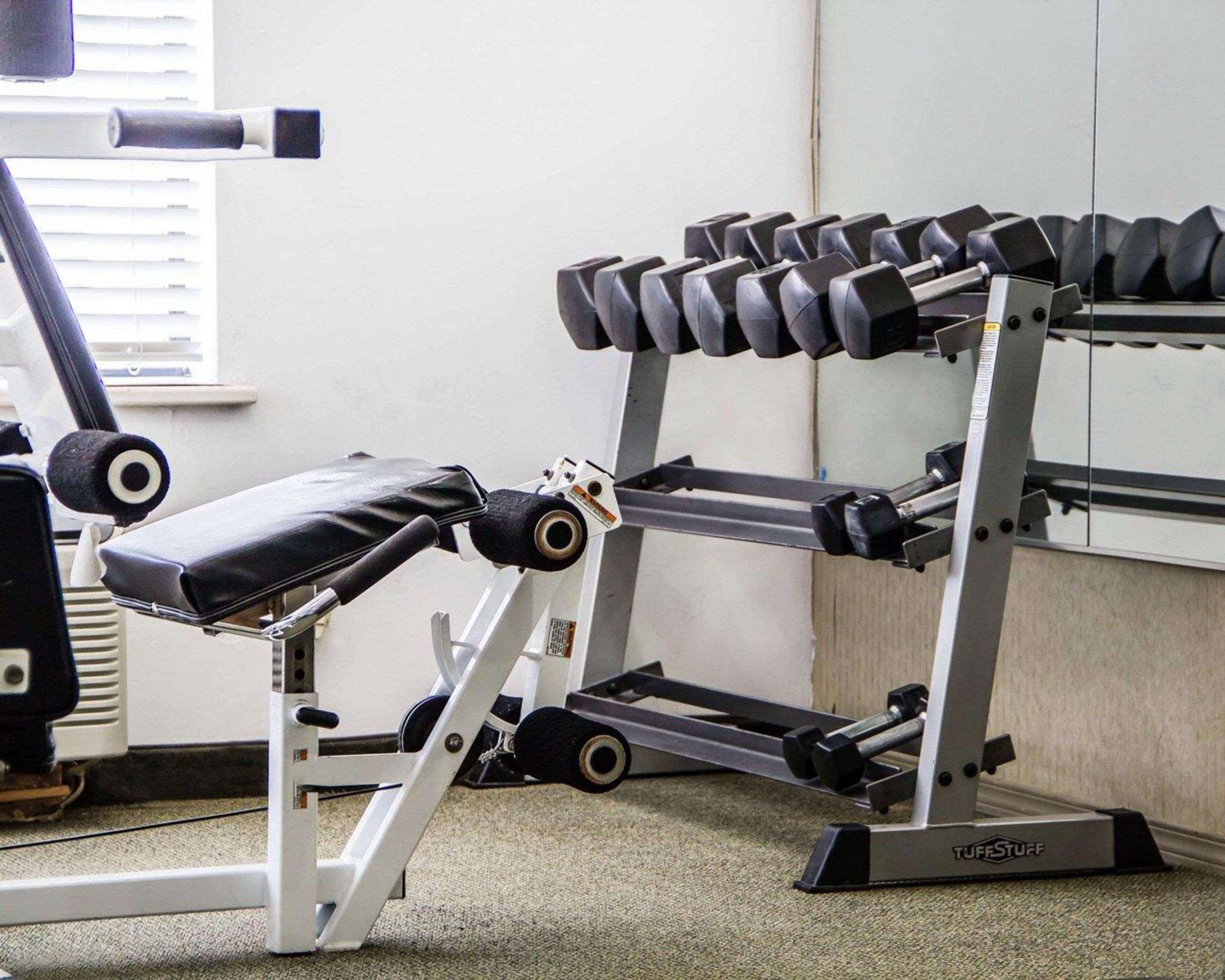 Fitness center with cardio equipment and weights | Comfort Suites McAlester